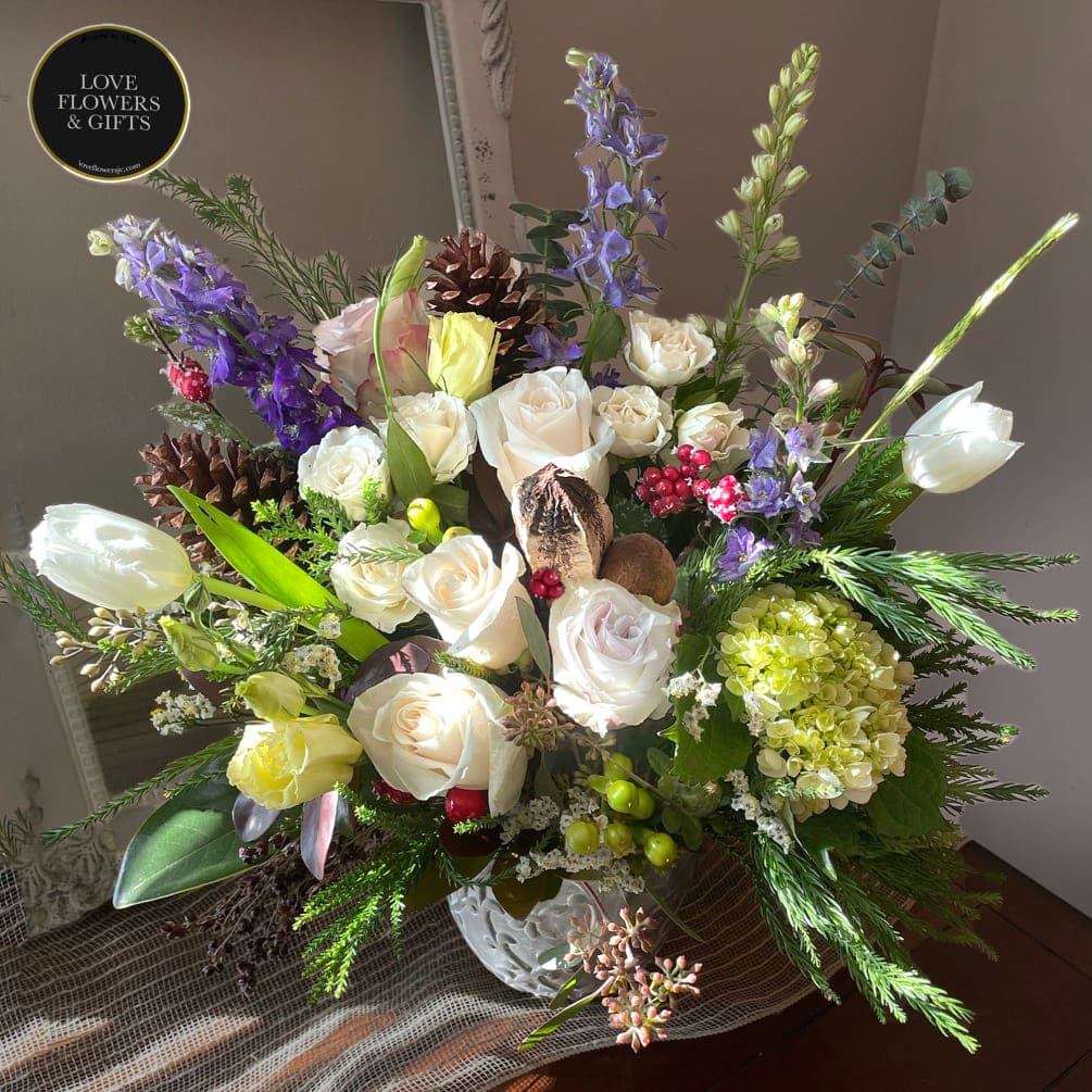 December  - Natural style of textures of winter designed in a charcoal ceramic vase made with lighter tones with hints of violets. 