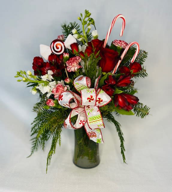 Peppermint Pines - Winter greens filled with red and white blooms.