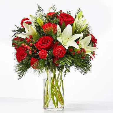 Joyful Greetings Bouquet - Spread cheer to your loved ones near or far with the Joyful Greetings Bouquet, full of cozy red and white blooms perfectly capturing the holiday spirit.