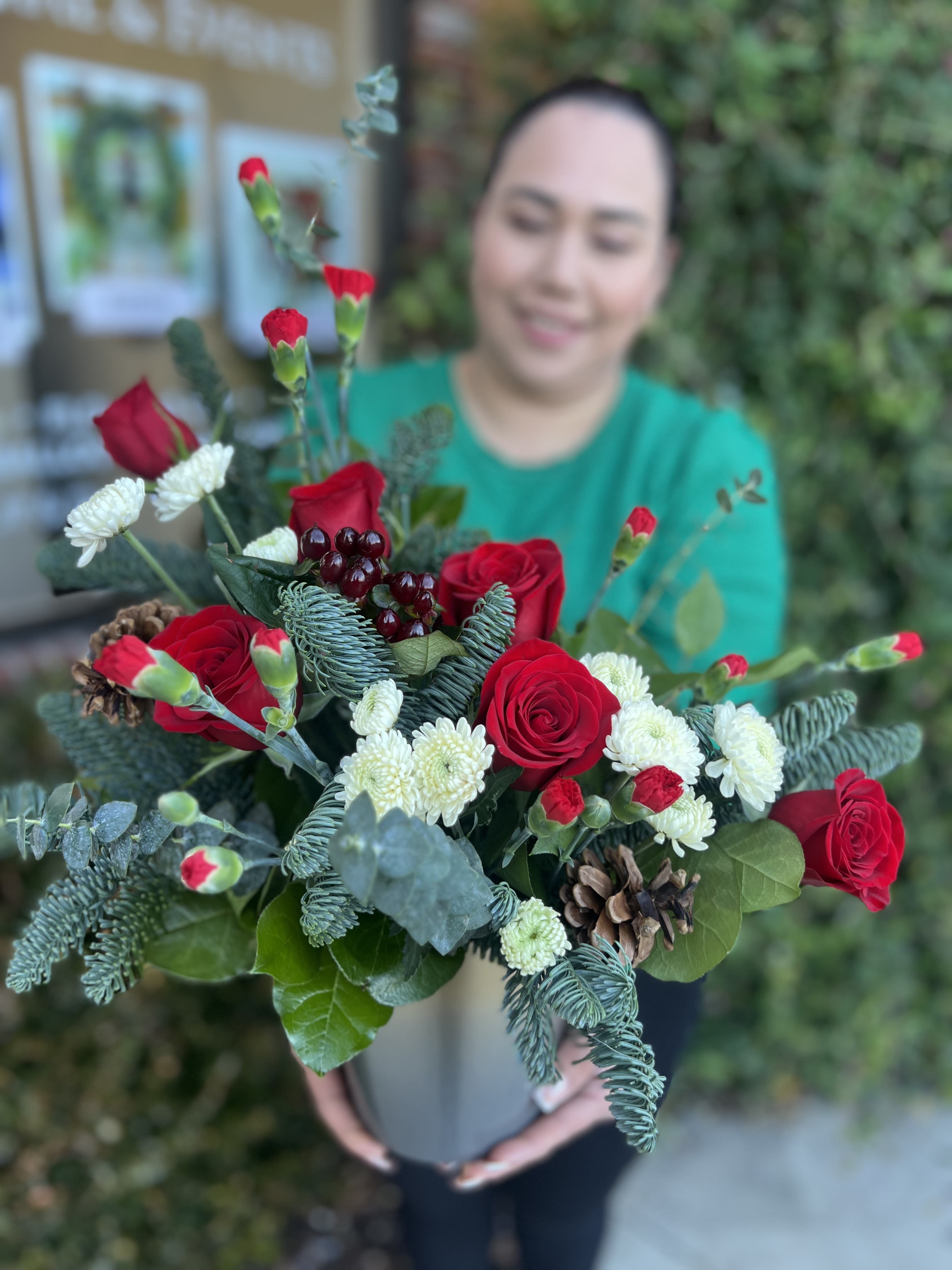 holiday 1 - seasonal flower with red roses and a ceramic base.