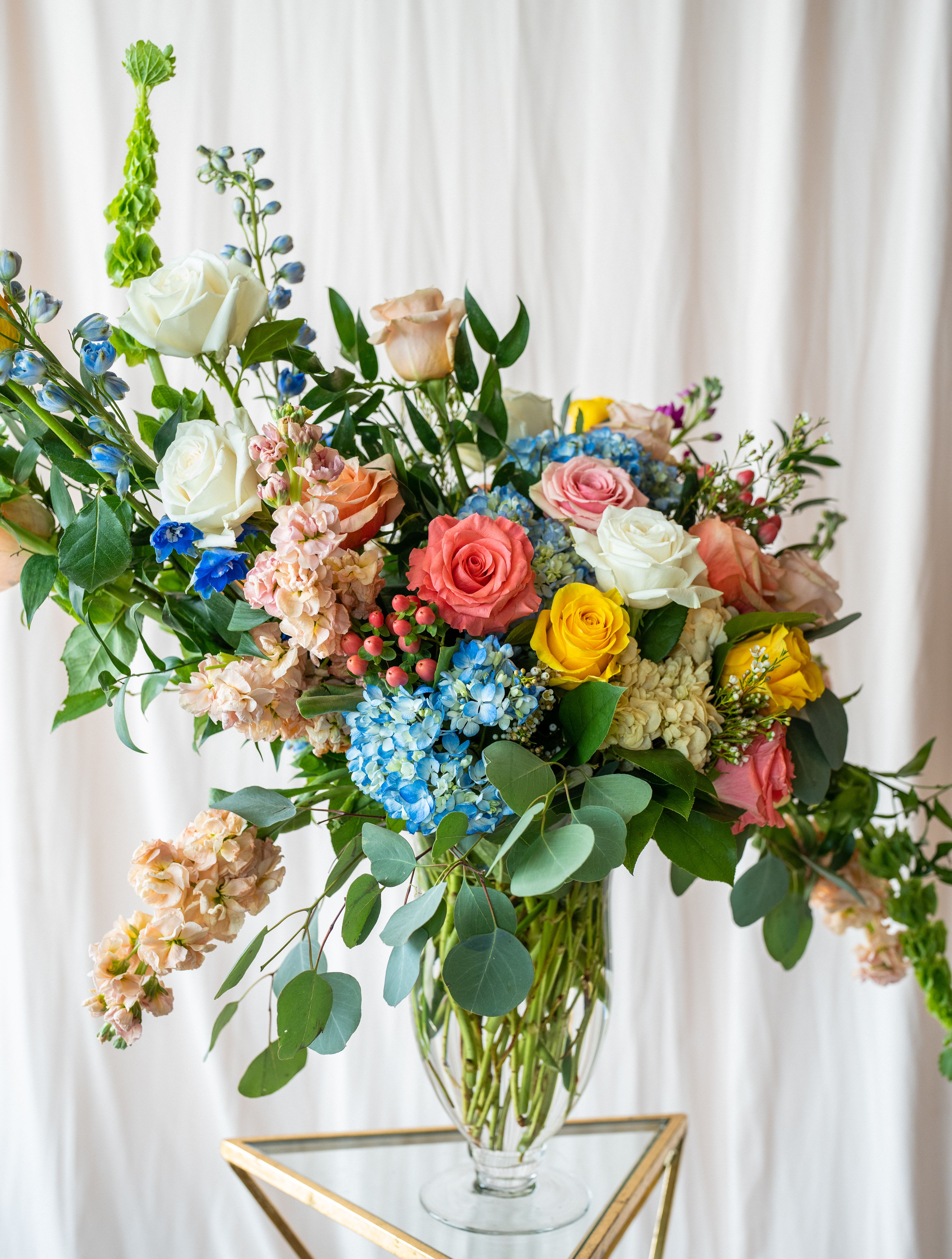 Garden Party  - A vibrant mix of citrus tones and ocean blues, perfect for summer gatherings or as a refreshing centerpiece for any occasion.