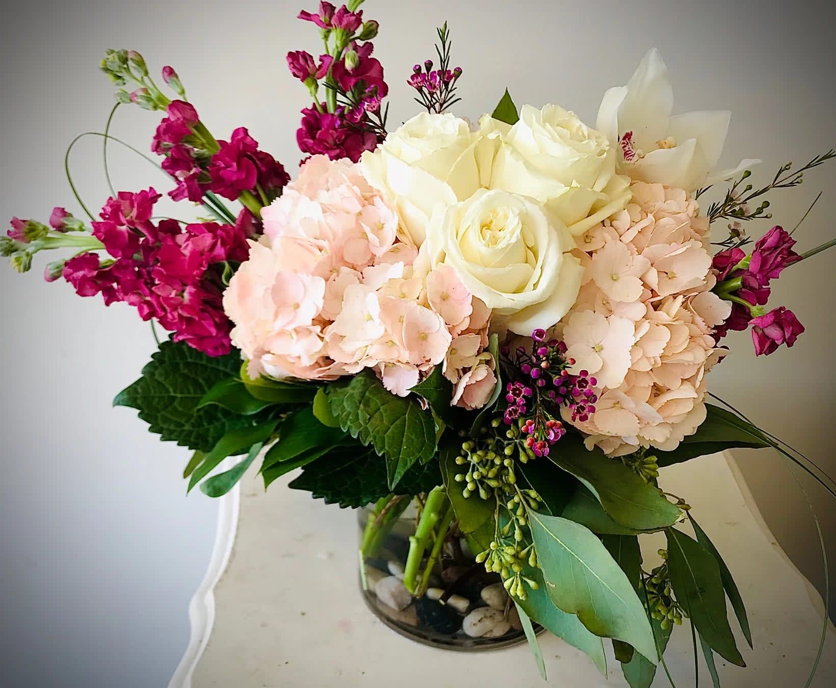 Blush and Beautiful - Welcome spring with this fresh combination of hydrangea, roses, stock, and rustic textures. A delightful gift for any occasion.