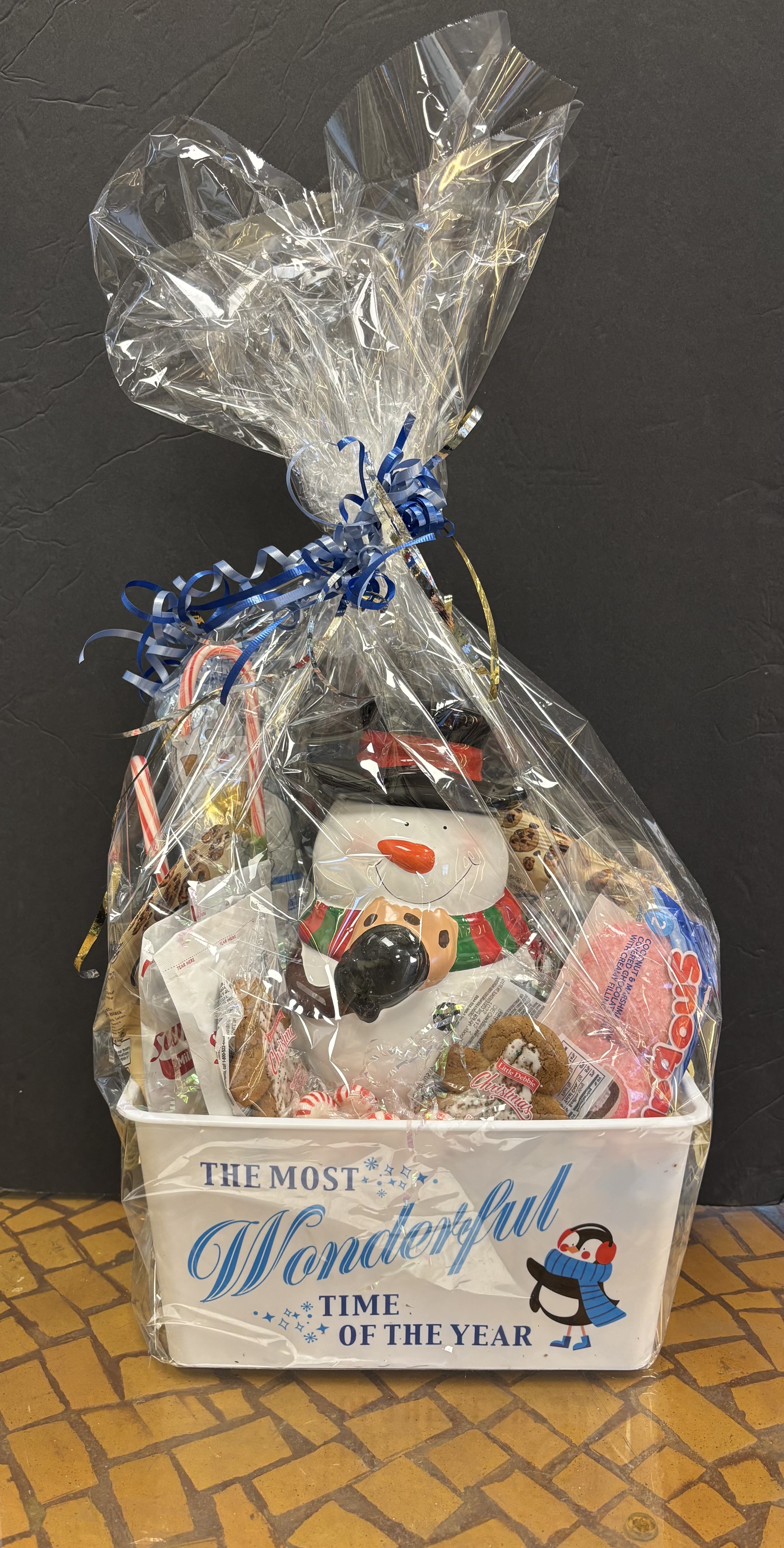 Snowman Cookie Jar Gift Basket  - This adorable snowman cookie jar gift set is perfect for any cookie lover! Includes an adorable Snowman cookie jar for a fun holiday keepsake. Loaded with all sorts of goodies.  LIMITED QUANITY AVAIABLE 