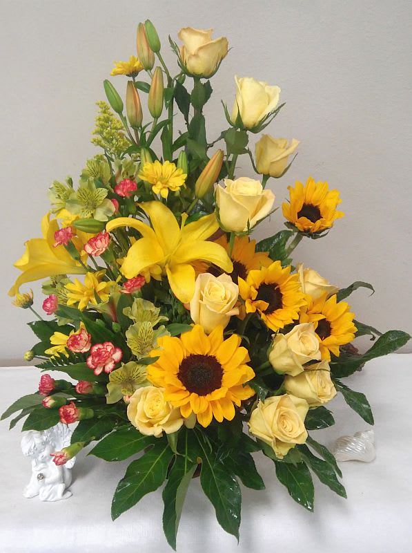 Garden Of Sunshine - For any occasion, our sunny garden of spring-fresh blossoms is sure to bring delight! Garden Of Sunshine offers a sign of a wish for healing and peace in a difficult time. The bouquet will be made approximately as seen vase may vary.