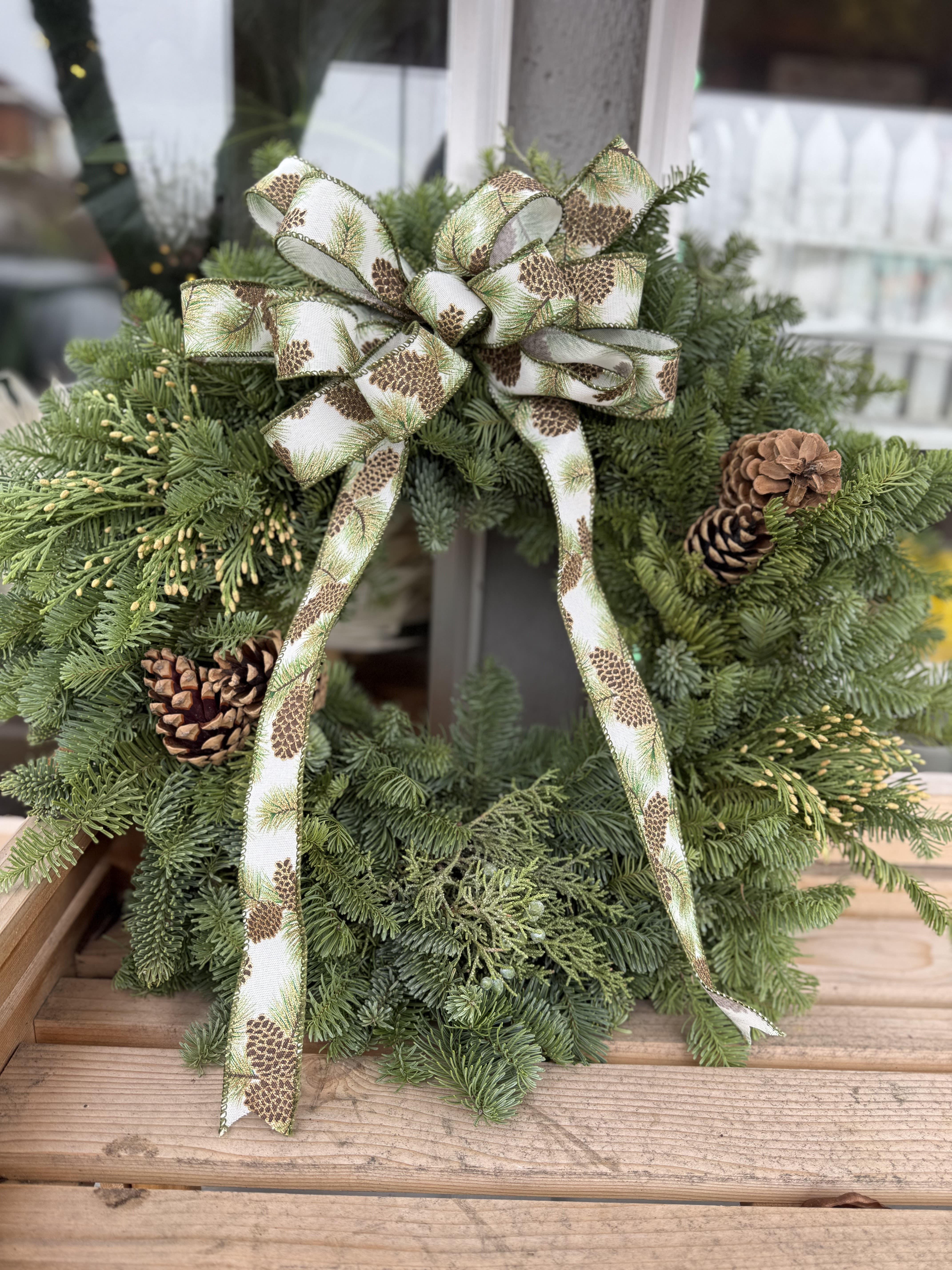 Classic Christmas Wreath - A classic wreath with plaid bow 20&quot; wide standard &amp; deluxe is 24&quot; wide.