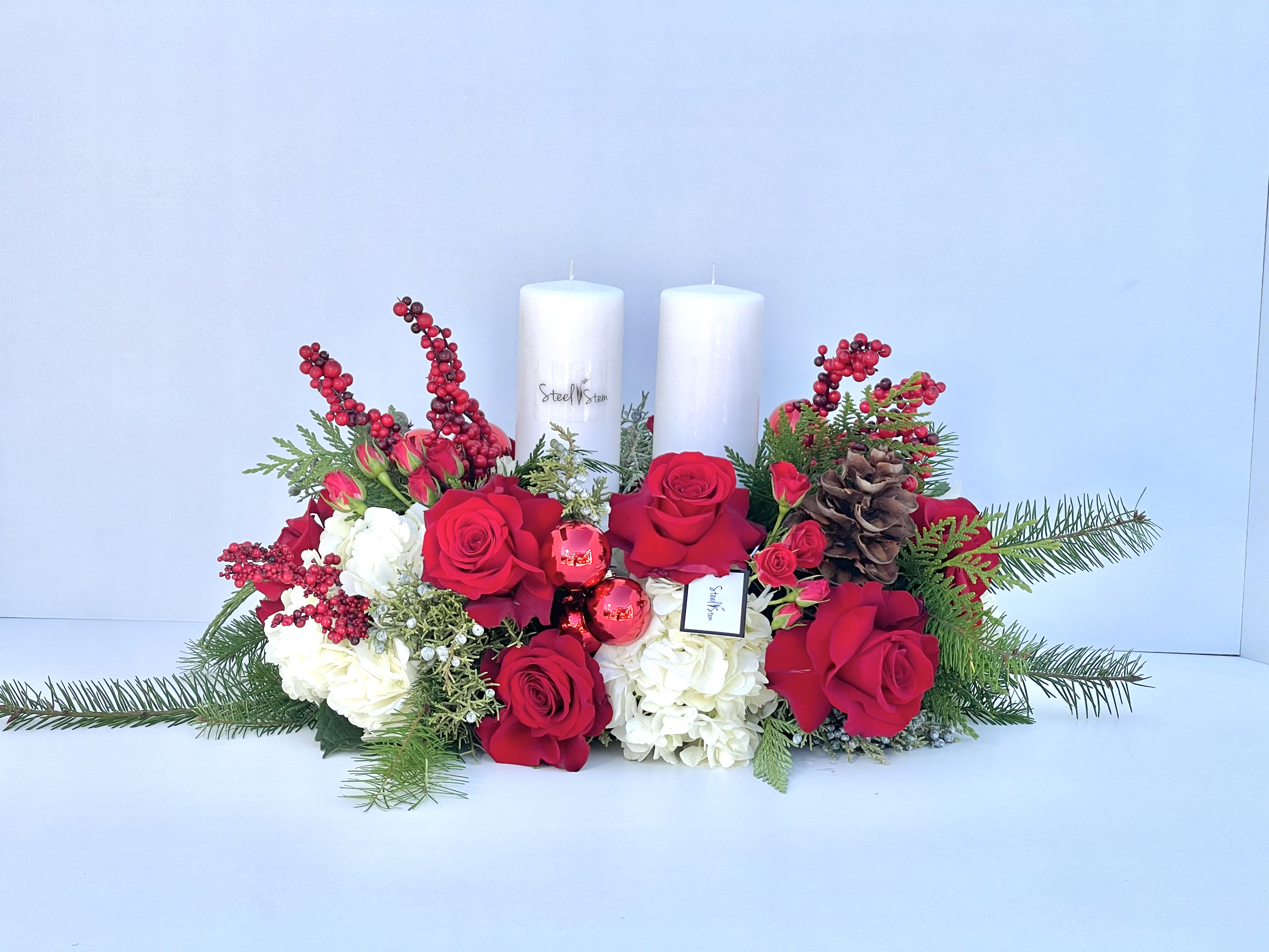  Christmas Centerpiece  - A beautiful lush Christmas centerpiece made of beautiful red and green florals.