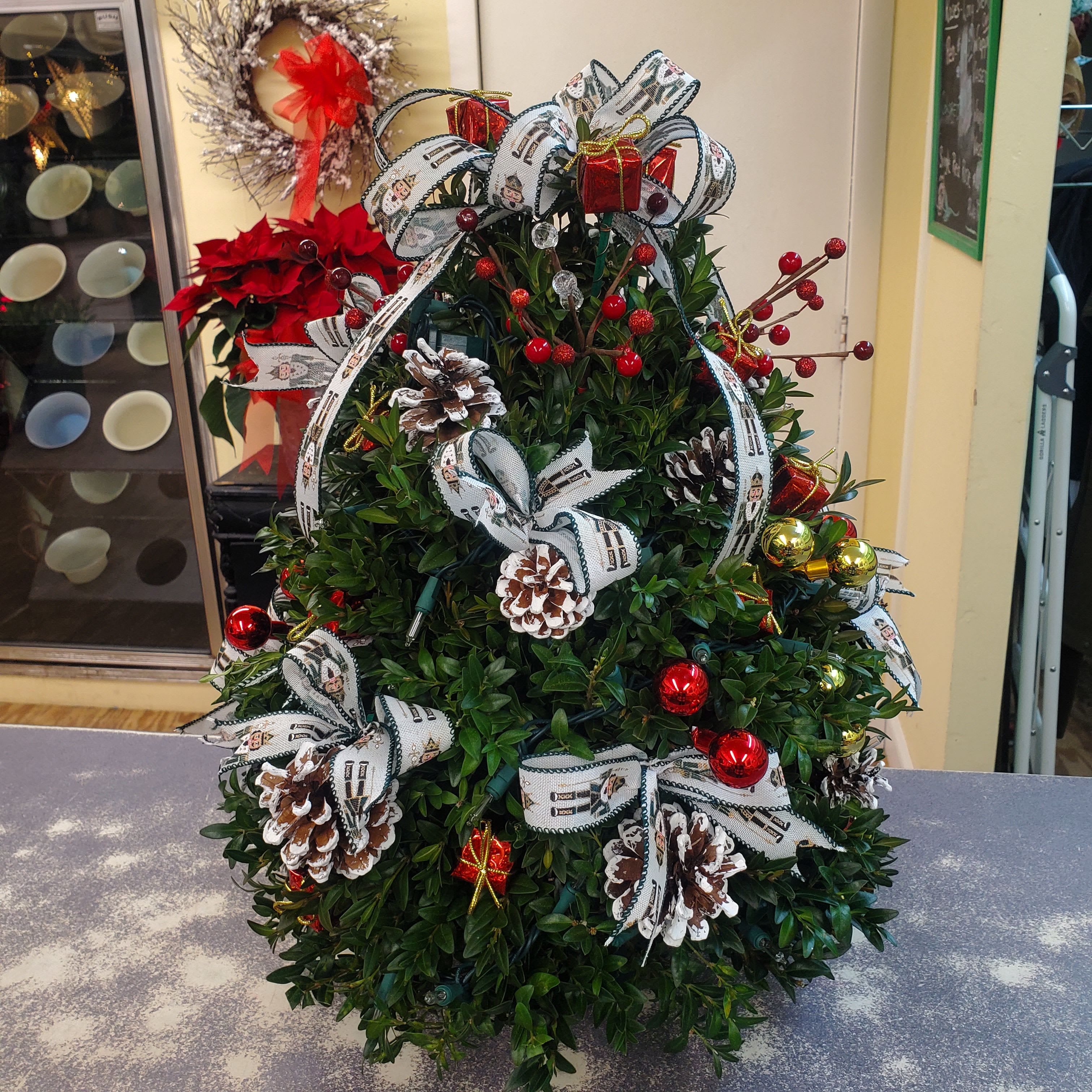 Boxwood Tree with Lights  - Handmade in shop Boxwood tree. Decorated with a strand of plug in lights and adorned with balls, festive glittery ornaments and holiday novelties.  Perfect for everyone on your gift list!  PLEASE NOTE: EACH TREE IS UNIQUELY DESIGNED AND DECORATED..WILL NOT BE EXACTLY AS PICTURED!!