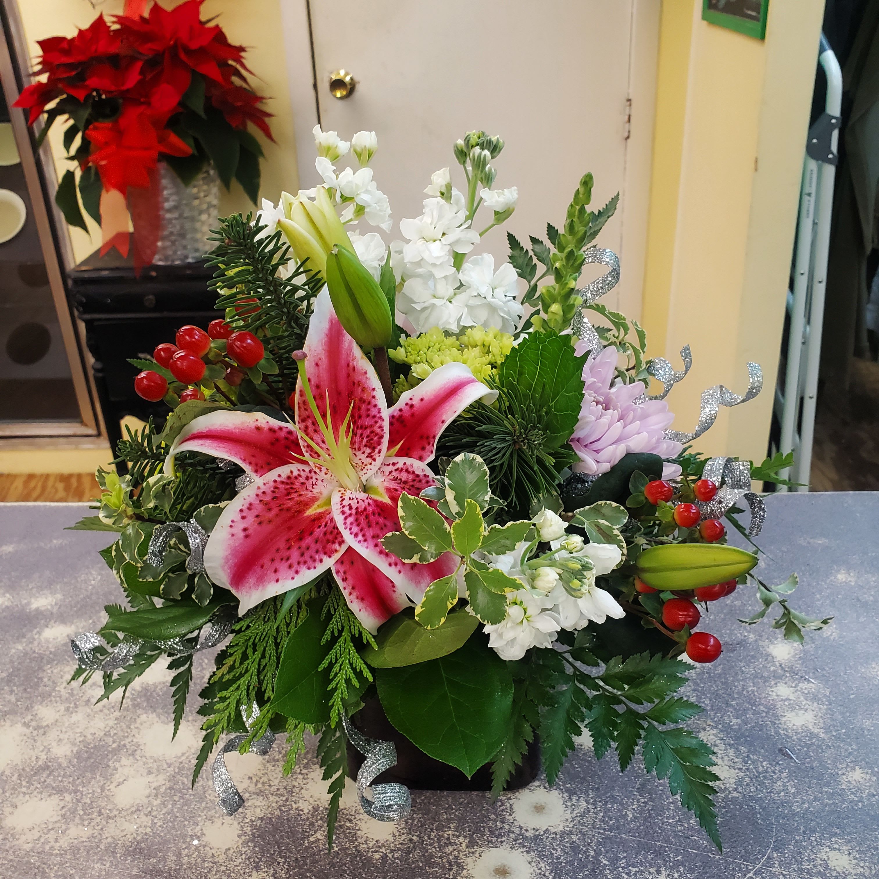 Pink Bliss  - A glass vase arrangement filled with assorted seasonal flowers in shades of pinks, lavenders and white. **Low compact design **