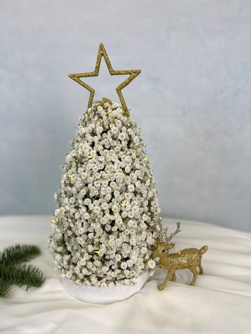 Baby’s Breath Christmas Tree - A luxurious winter tree crafted from clouds of baby’s breath and crowned with a gold star topper. This snowy design brings a clean, elegant holiday look to any space. Perfect for Christmas decor, office gifting, and winter celebrations.