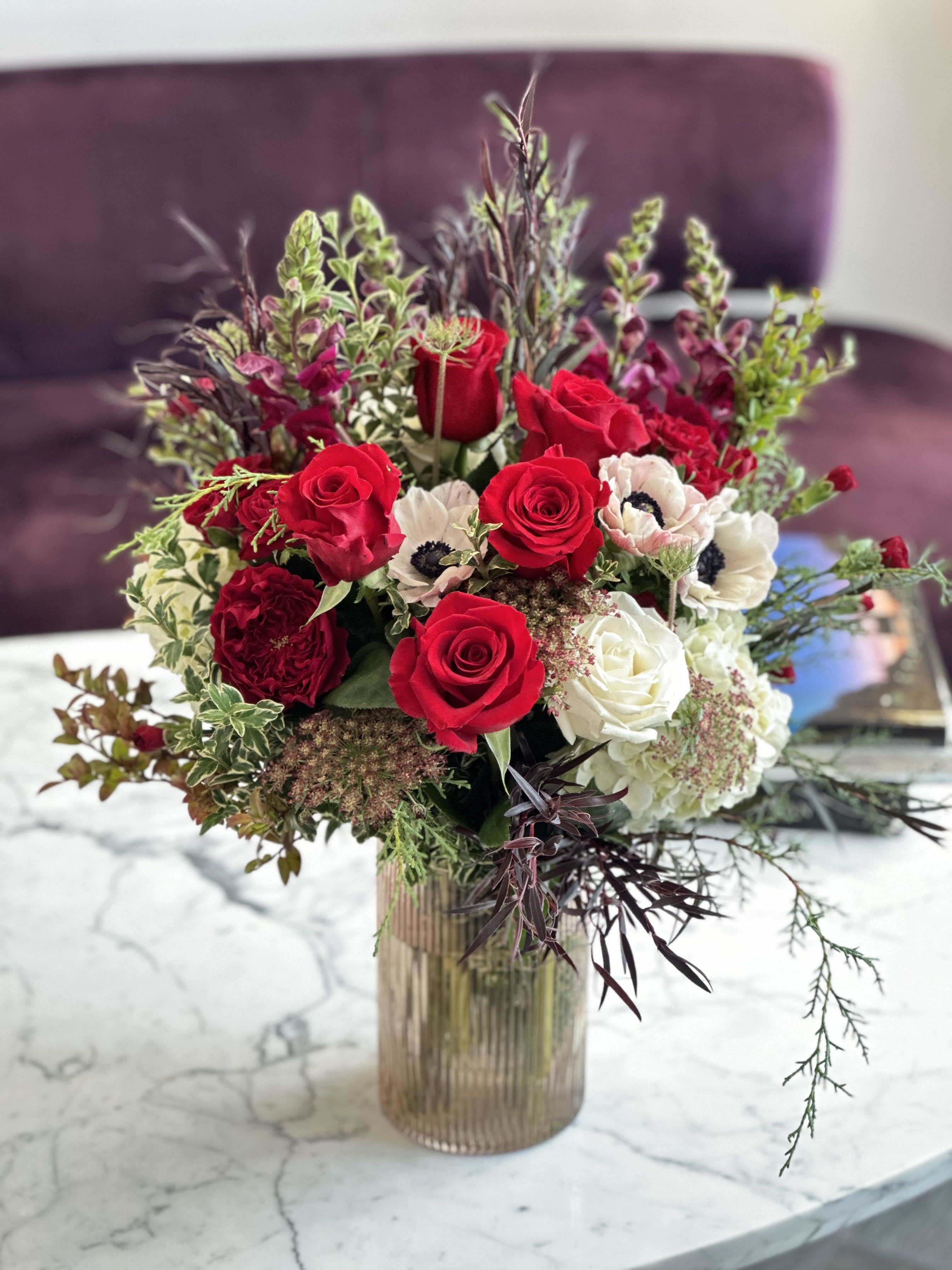 As You Wish - Beautiful lush wintery design of classic red roses and delicated white and chocolate color blooms. 