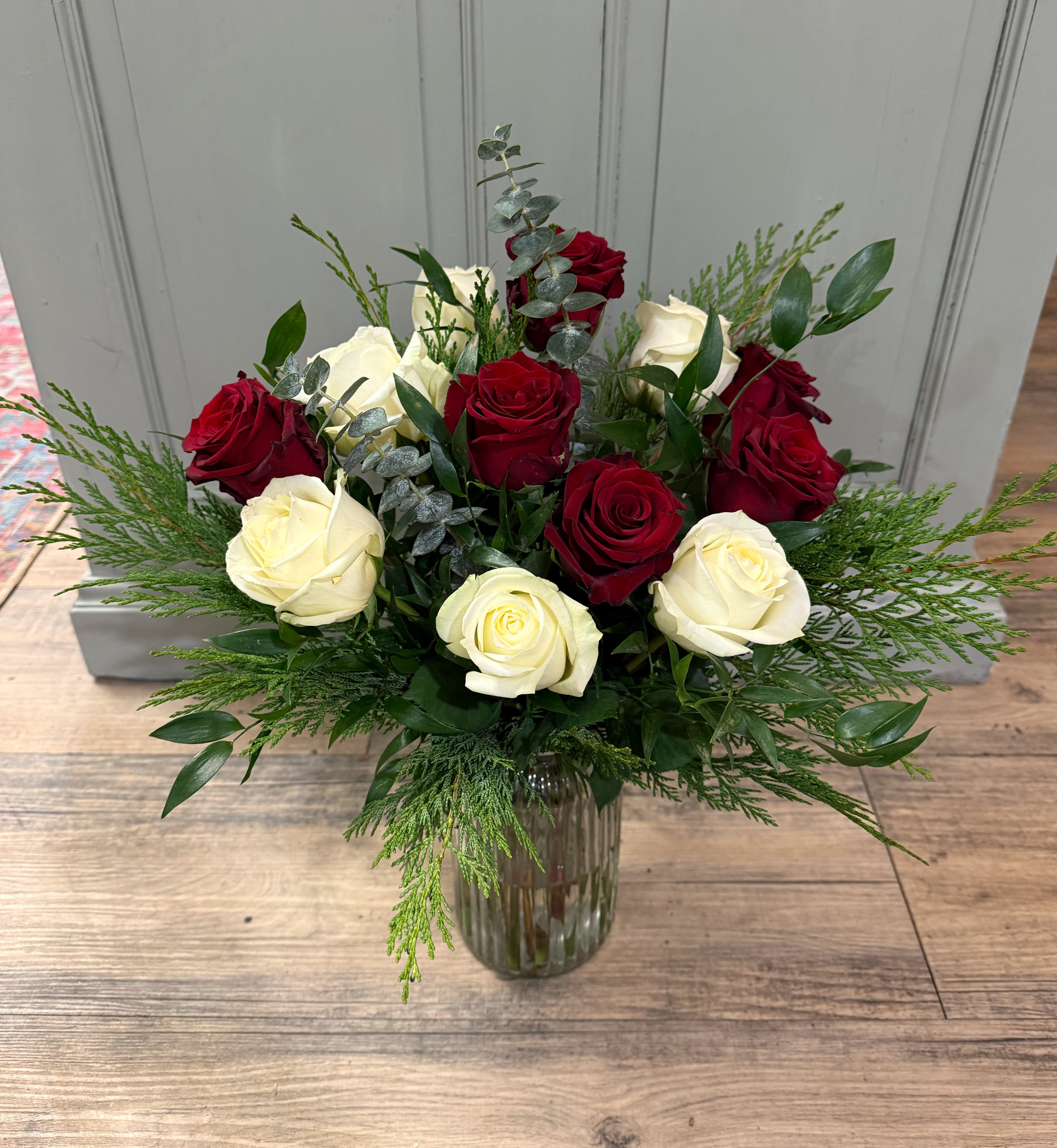 Christmas Dozen - One dozen of mixed white and red roses. Standard as shown, upgrade to add extra flowers such as stock, snapdragons etc!