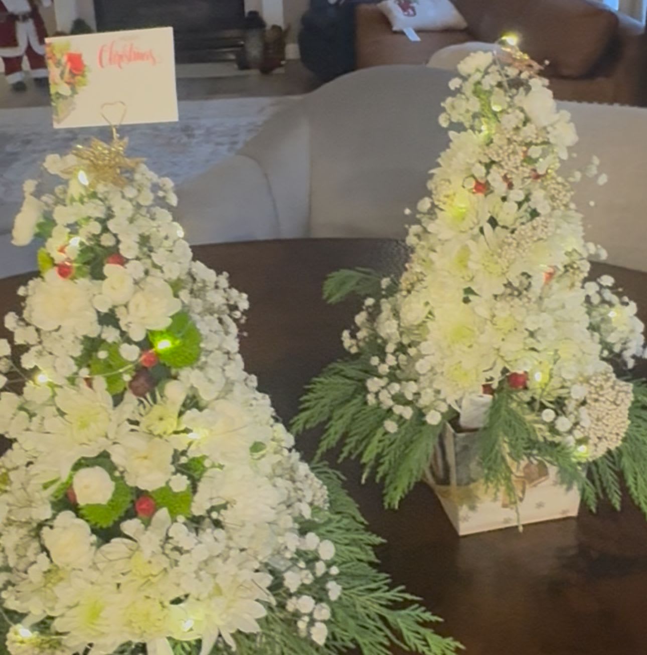 christmas tree centerpiece - This magical tree has fresh pine, white mums, Roses, hypericum berries garland, babies breath and a beautiful poinsettia accent tree topper. Perfect gift or table centerpiece!Color Palette Red, Green and white.