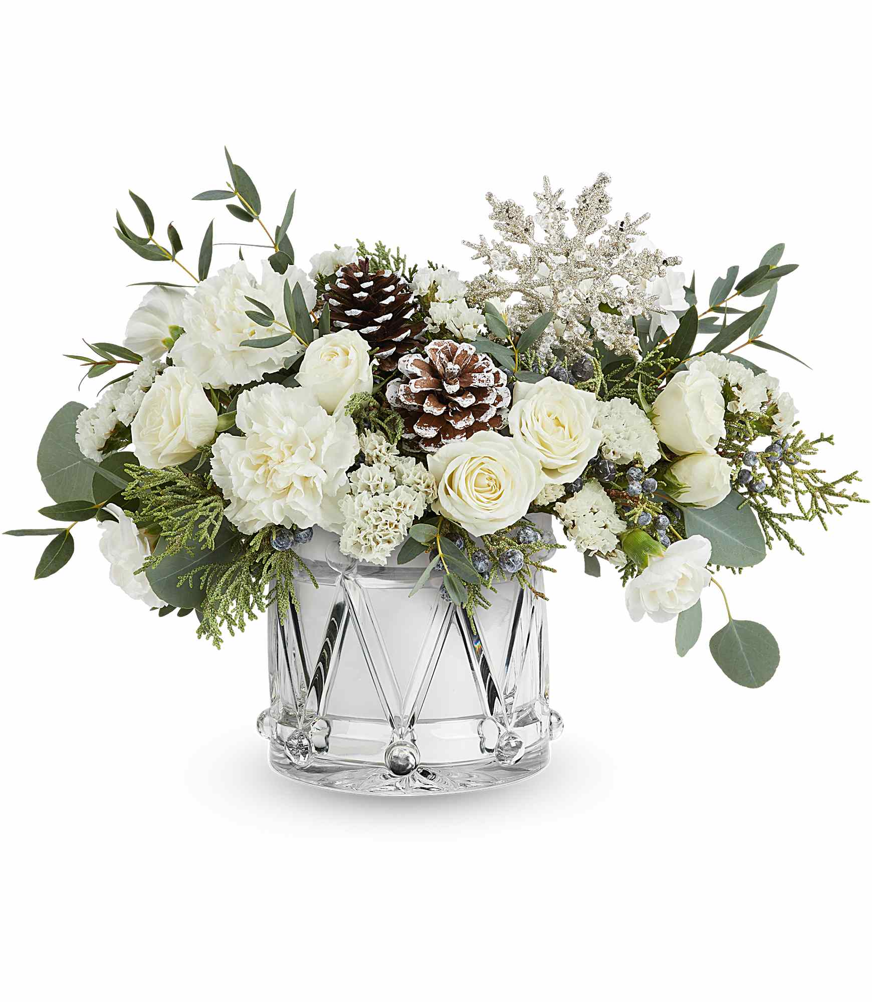 Teleflora's Sparkling Wishes Bouquet - Sparkling Wishes Bouquet is a winter wonderland of white blooms, fresh greenery, and frosted pinecones. Arranged in Teleflora's keepsake Crystal Drum Vase, it's a stunning gift for the holidays or New Year. Teleflora's Sparkling Wishes Bouquet includes white spray roses, white carnations, white miniature carnations, and white statice. Accented with juniper, parvifolia eucalyptus, and silver dollar eucalyptus in Teleflora's Crystal Drum Vase Orientation: All-Around 
