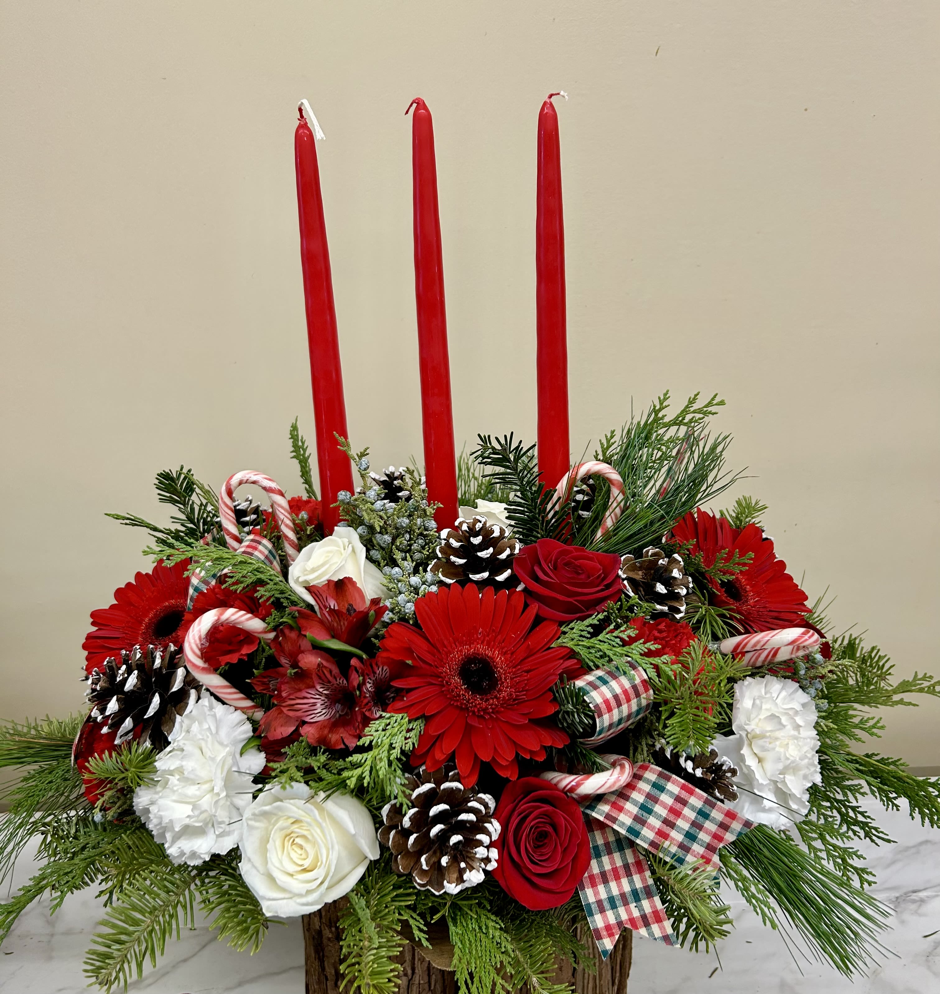 Oblong Christmas centerpiece  - Mixed Christmas greens with red and white flowers