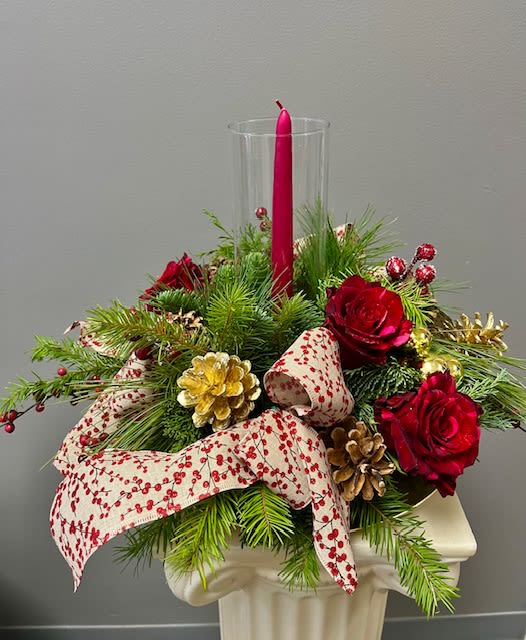 CRANBERRY SPRITZ - A photo does not do this centerpiece justice, it is stunning. Cranberry and gold are the main characters in this design with a cranberry candle enhanced with a hurricane glass as a finishing touch.