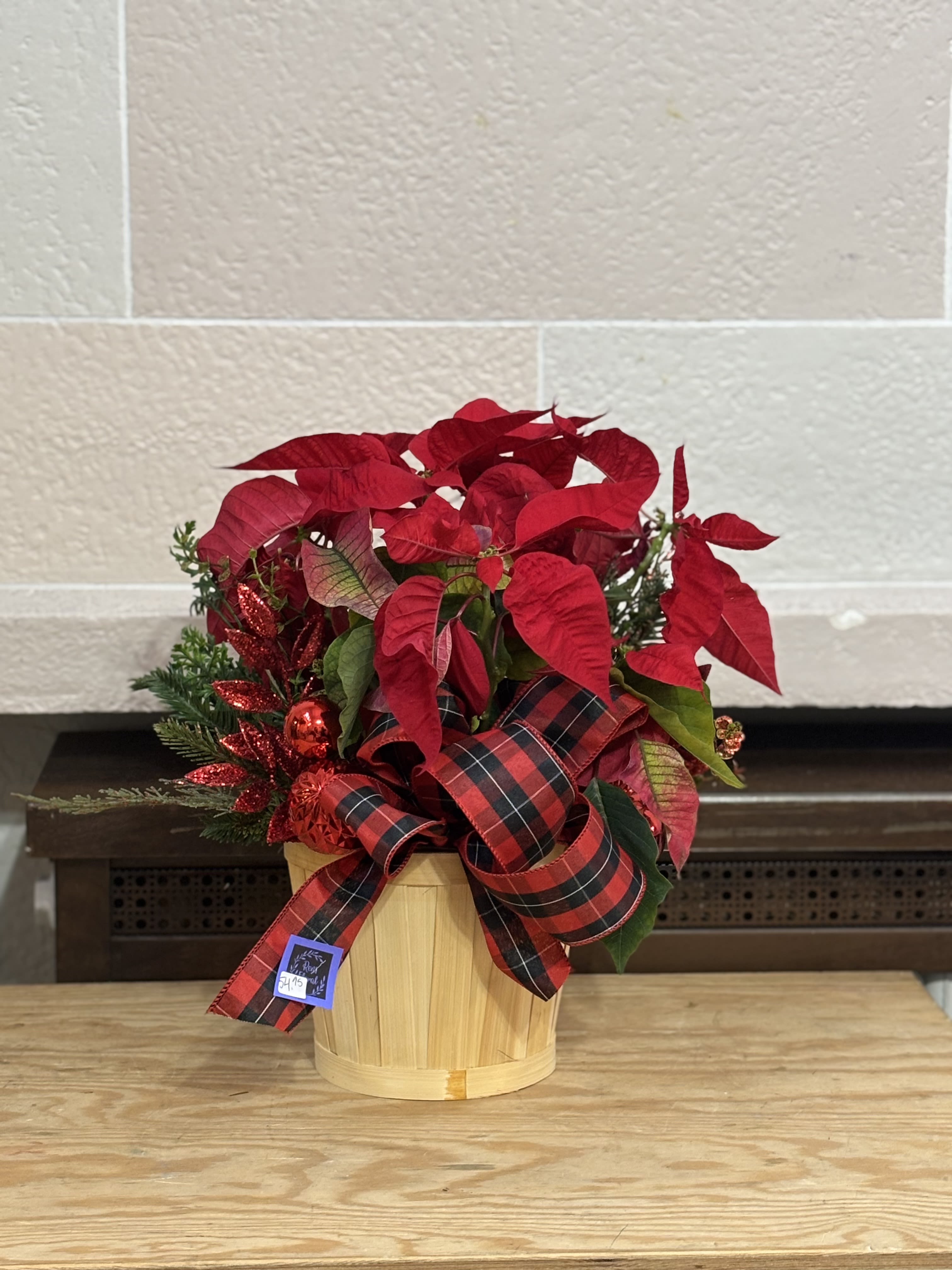 Ornament Pointsettia  - A 6&quot; poinsettia in a basket with ornament and pine artificial added. 