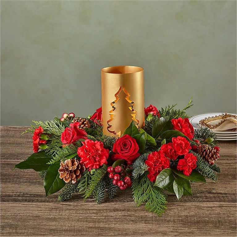 December Dreams Centerpiece - Radiant red blooms fresh evergreens pinecones and a glowing golden lantern to light up your holidays 