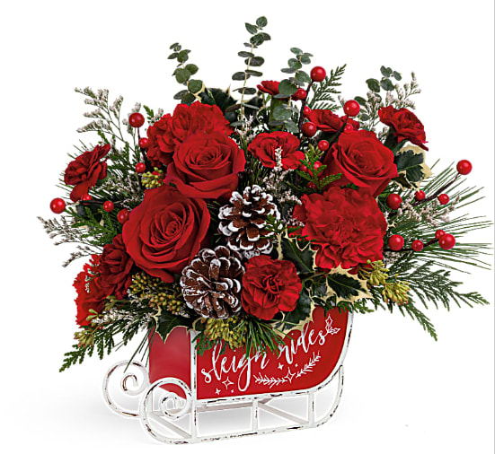 Vintage Sleigh Ride Bouquet - Dashing through the snow in a flower-filled open sleigh! Fun and festive, this vintage metal keepsake sleigh is the perfect vehicle for a joyful holiday bouquet.  Red carnations, miniature red carnations and white limonium accented with select Christmas greenery, delivered in a Vintage Sleigh Ride Keepsake,