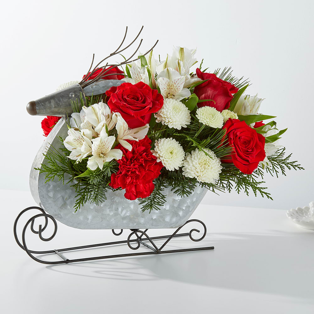 The Prancer Bouquet  - This silver rustic keepsake is filled to the brim with fresh christmas greens and festive red and white blooms. 