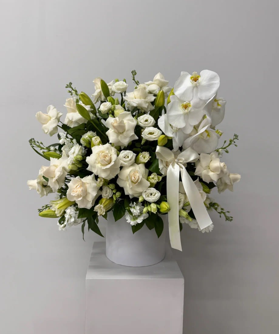 White Glove Elegance - Pure, polished, and impossibly chic. A statement piece that whispers luxury in every petal.