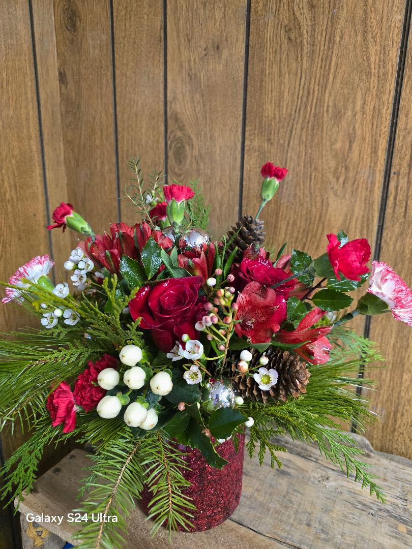 Teleflora Magical Wish Bouqt - Red Glass Cylinder with Red carnations, Red Mini Carnations, Red Spray Roses with Christms Greens &amp; Pinecones