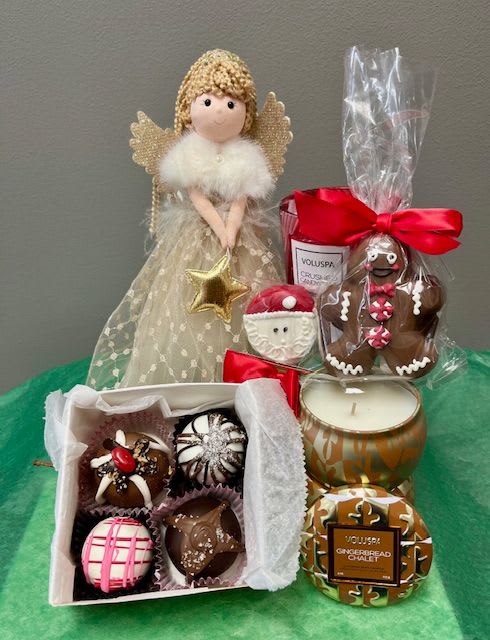 THE SUGAR PLUM FAIRY - This is a flower free gift set. It comes with four Sweet Shop Truffles, an Oreo-pop decorated for the holidays, a fudge truffle Gingerbread Man, a Gingerbread Chalet Voluspa mini tin candle, an 8oz Crushed Candy Cane Voluspa glass jar candle, and the sweetest fairy complete with a wand, tiara, and wings.  