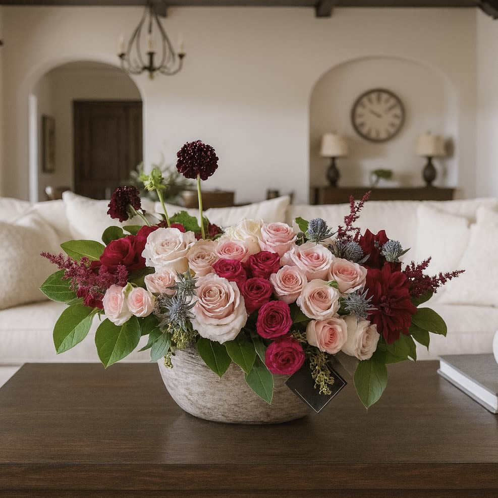 Bel Aire - Introducing Bel Aire—the perfect way to impress that special someone! This elegant boat-shaped arrangement is sure to make the perfect statement. Our stunning hand-crafted piece offers an exquisite combination of roses, spray roses, and other florals that give texture and contrast in color for an unforgettable presentation. Make your next special occasion extraordinary with Bel Aire!