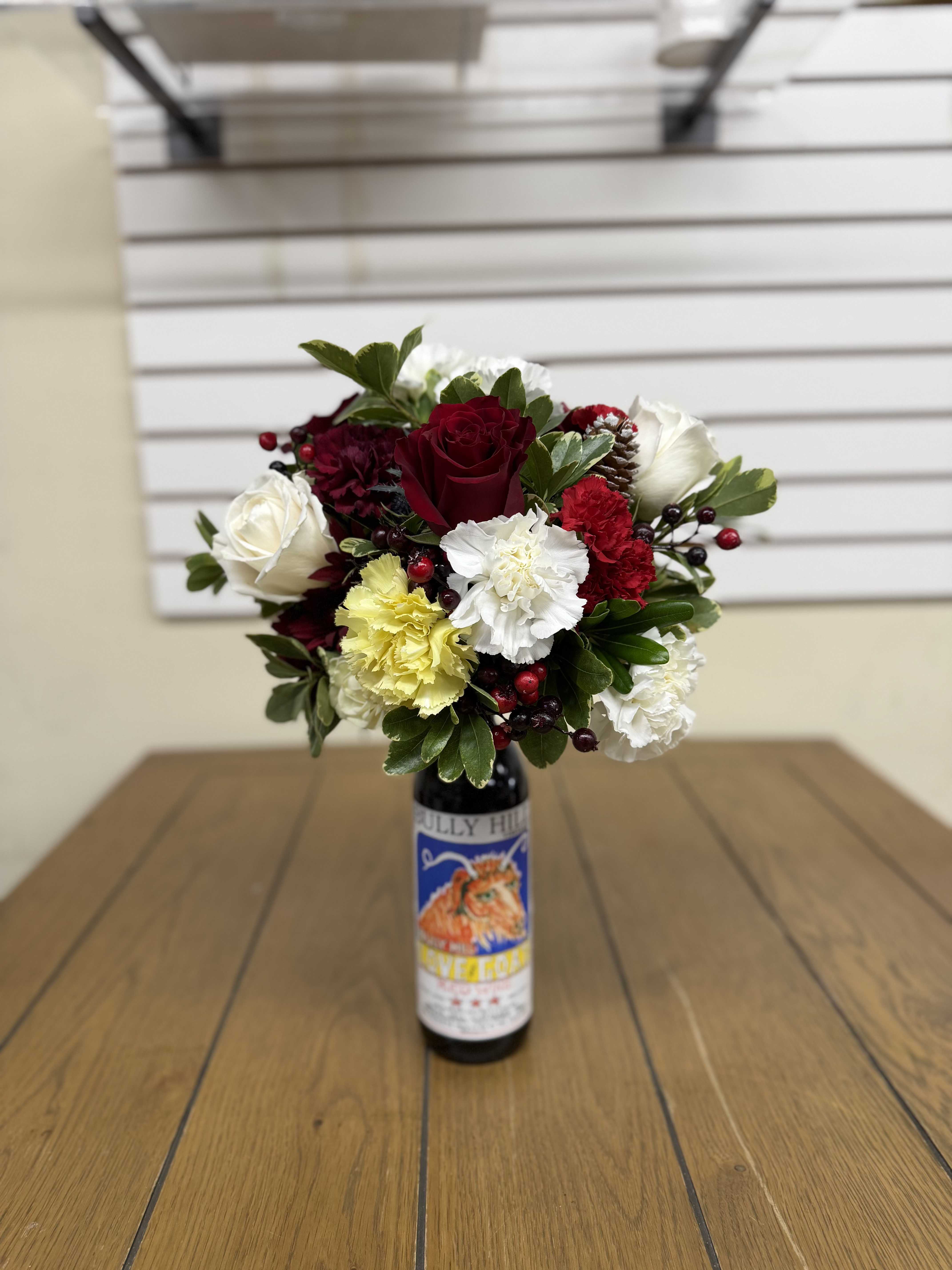 Wine Topper Bouquet - Gift your friends or family a small centerpiece delivered on top of a wine bottle this holiday season! Comes in small, medium, and large sizes! Fully customizable for colors, and flower preferences, or let our designers do their thing!