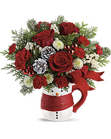 Christmas Mug Bouquet - •This sweet holiday bouquet features red roses, red carnations, red miniature carnations, white button spray chrysanthemums, white statice and mixed christmas greens. (holiday mug will vary)