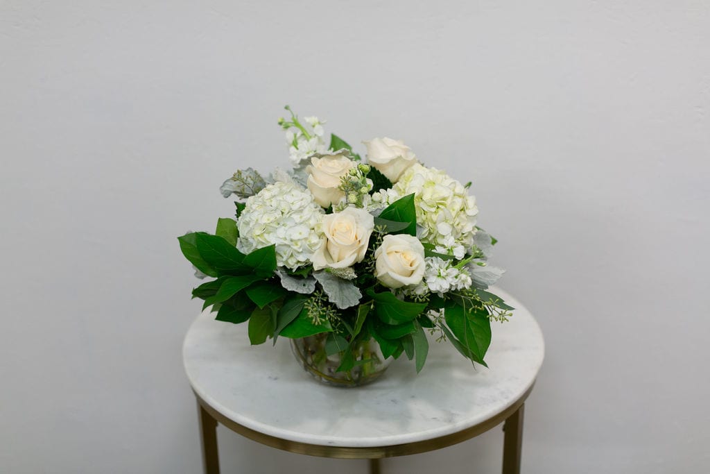 Classy Chic - Desire a floral arrangement designed elegantly in a simple color palette? This arrangement designed in a glass bubble bowl included hydrangea, roses and more in a simple and clean color scheme - so chic!