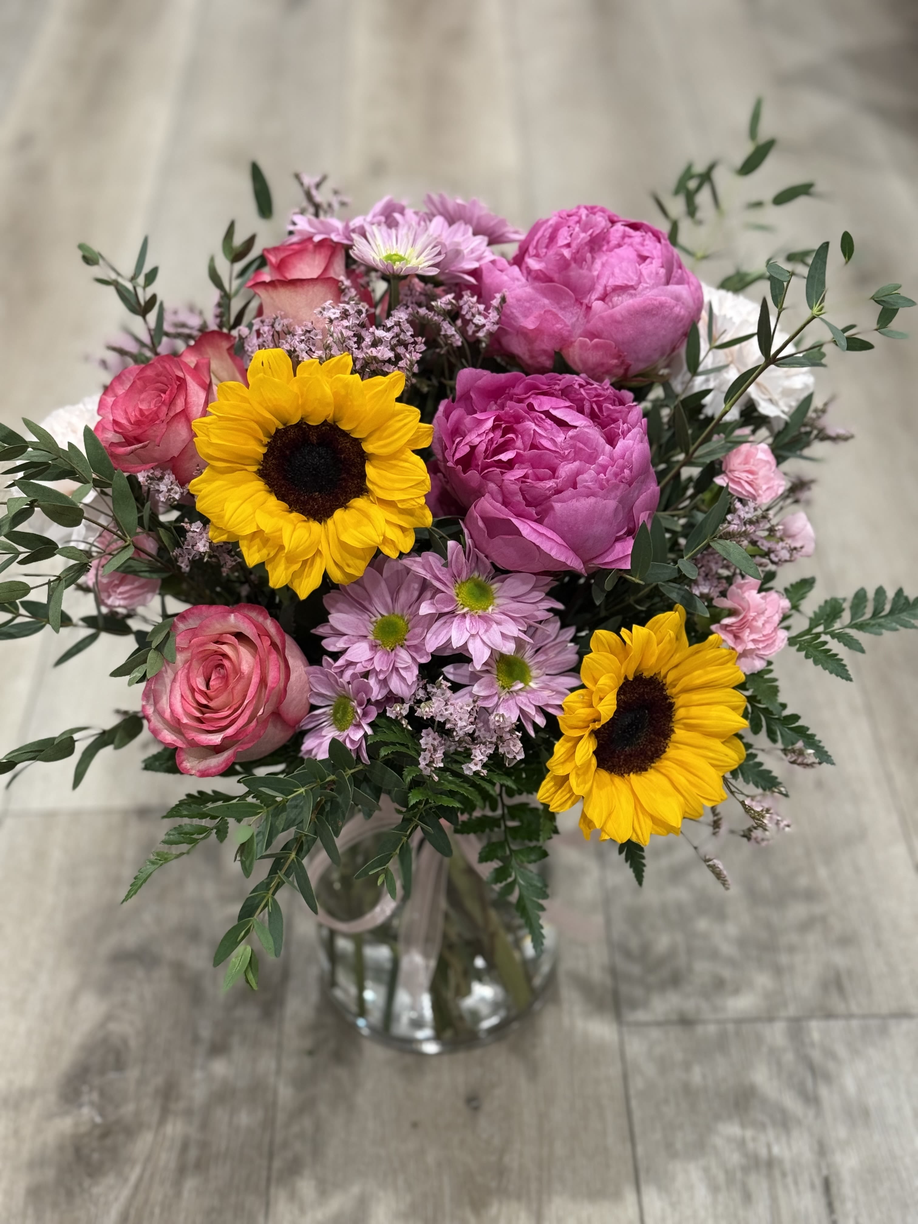 Pink Sweetheart  - Arrangement includes peonies, roses, carnations and daisies  Celebrate your loved one with a beautiful pink tone arrangement 