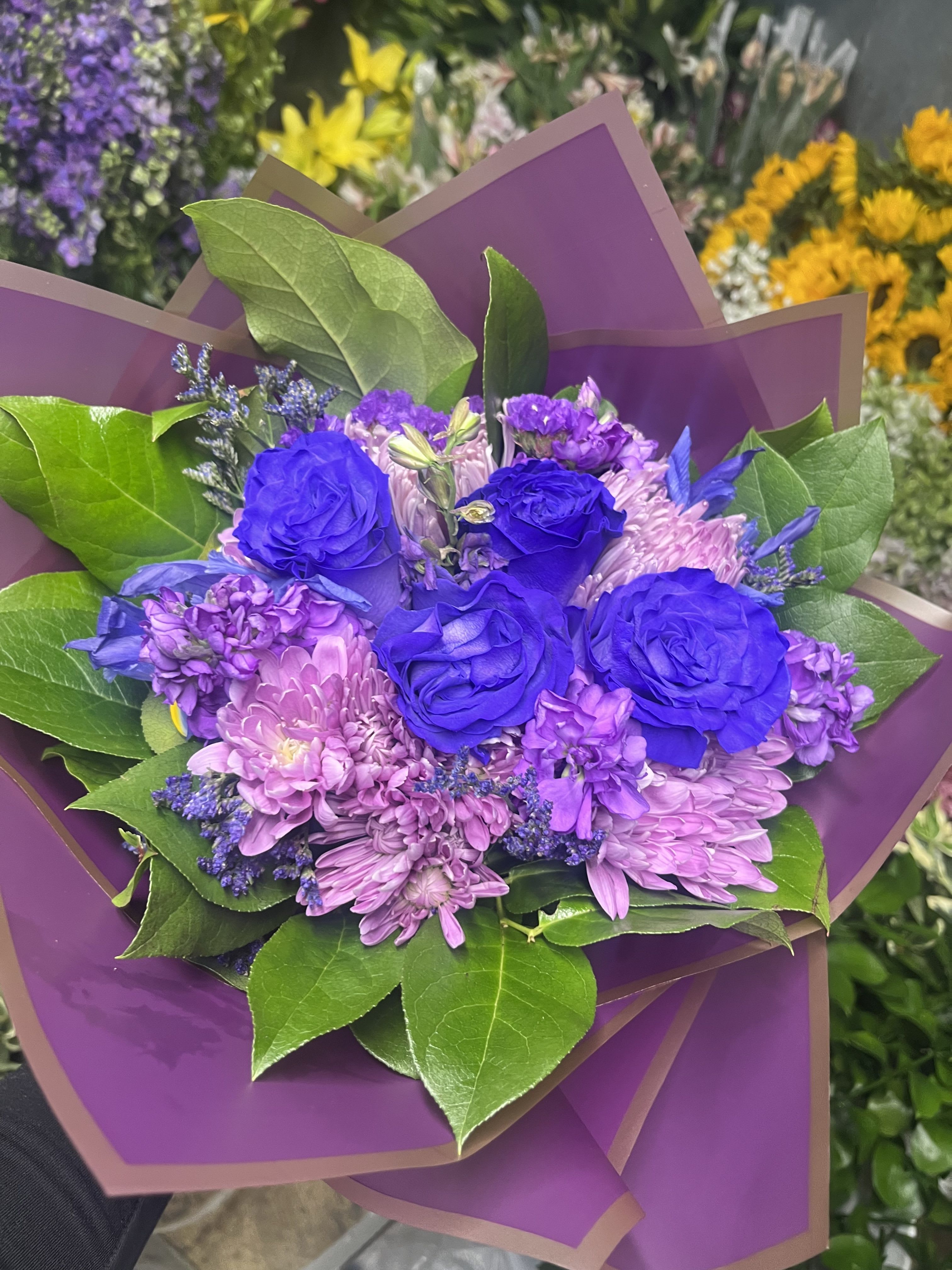 Purple bouquet  - fresh purple and blue flowers wrap in purple wrapping 