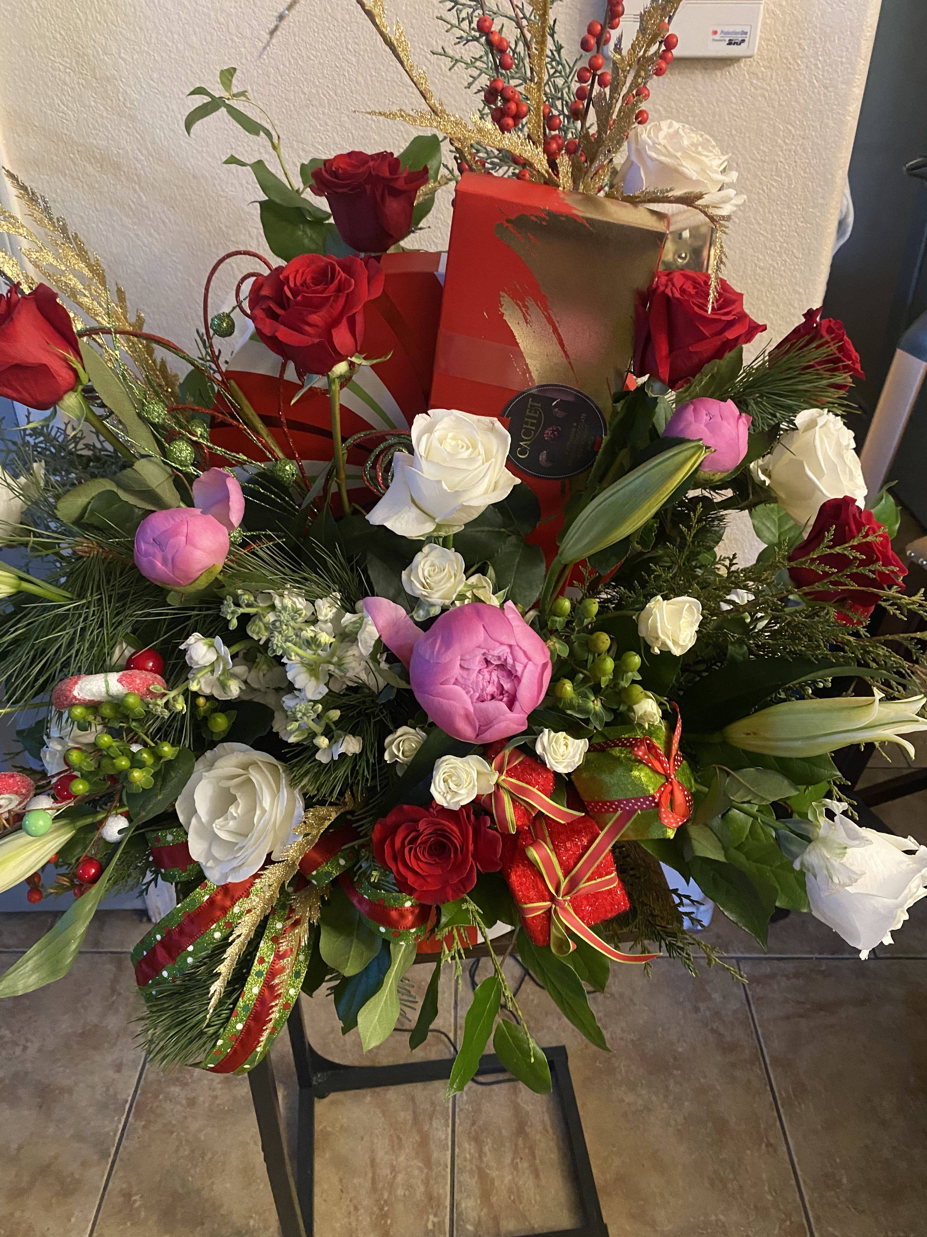 Great Big box of holiday joy !  - Fun filled holiday keep sake box of roses, peonies, stock and holiday greenery with holiday ribbon, bulbs and more.   Includes a box of Belgium chocolates too. 