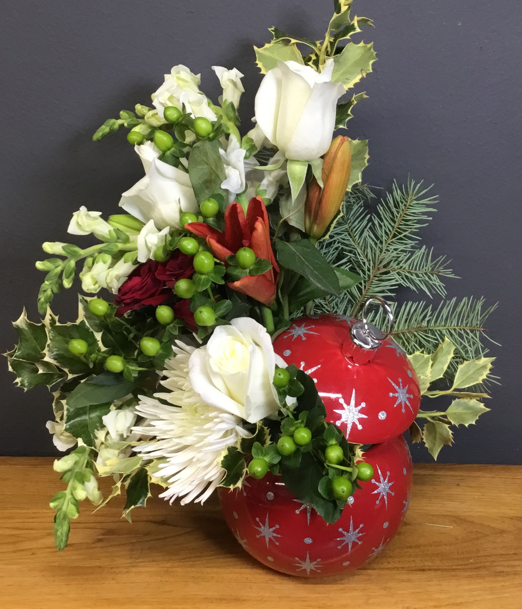 Twinkle Ornament Bouquet - Bring holiday cheer to your home this winter season! This arrangement comes in a glass ornament vase that can be used as a jar after the flowers are gone. Flowers may vary. 