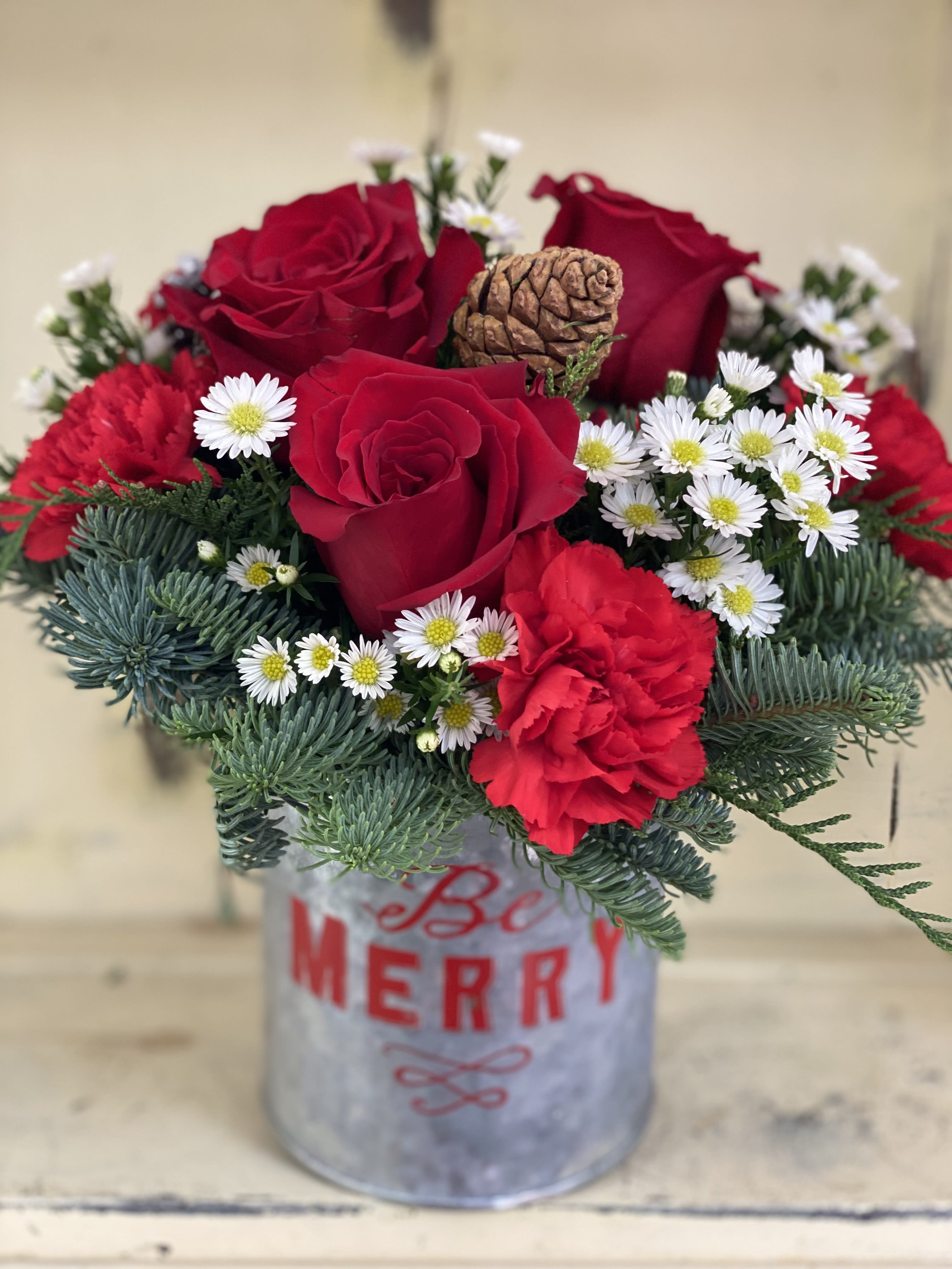 Be Merry!!! - Deck the halls with this festive arrangement of rich red and winter whites accented with fresh Christmas greens! The unforgettable gift is delivered in a vintage style galvanized tin decorated with a Be Merry design!