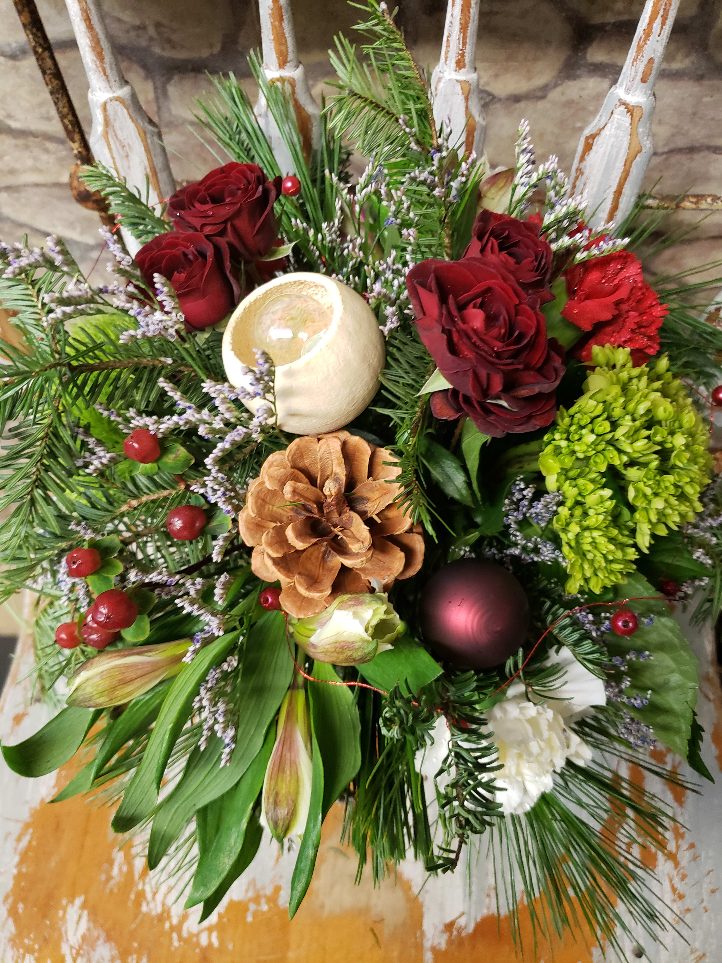 Barrington Hall Christmas  - Seasonal evergreens, with a touch of blooms would vary. The gray/silver tone enhances the container. Classic Centerpiece for the hostess table or business gift. Expanding the photo will show the festive &amp; natural details. All designs are custom n uniquely designed with similarities, but custom to the fresh flower variety of the day.