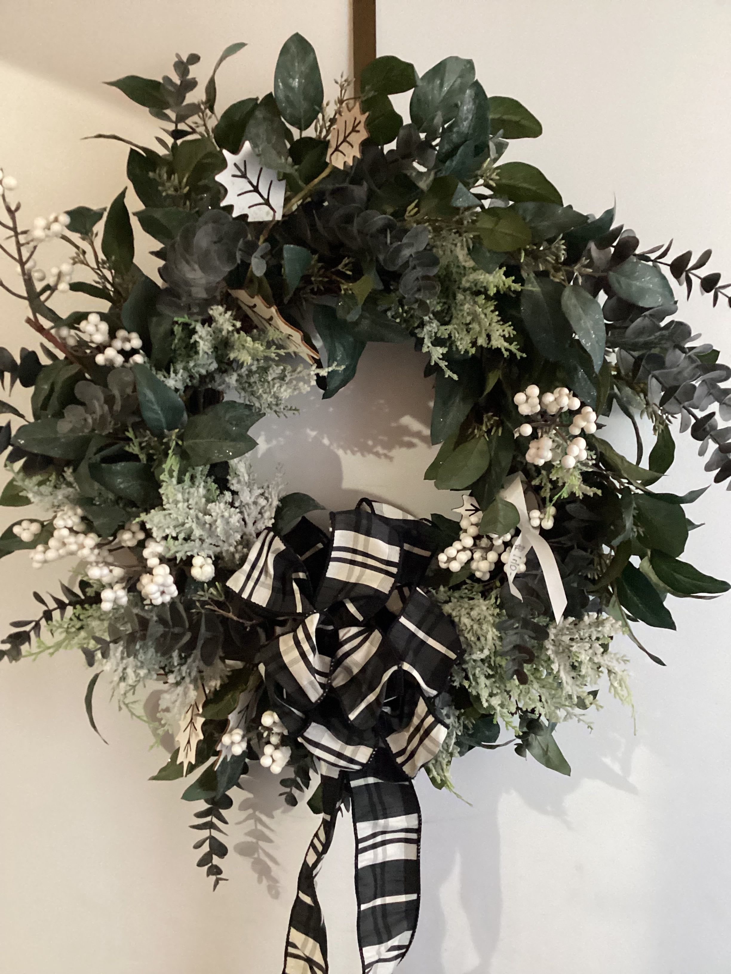 Permanent Black and White Wreath - A classic looking black and white wreath with berries and striped ribbon 