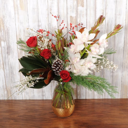 Winter Elegance - Stunning blooms of orchids &amp; roses in a gold plated vase.  