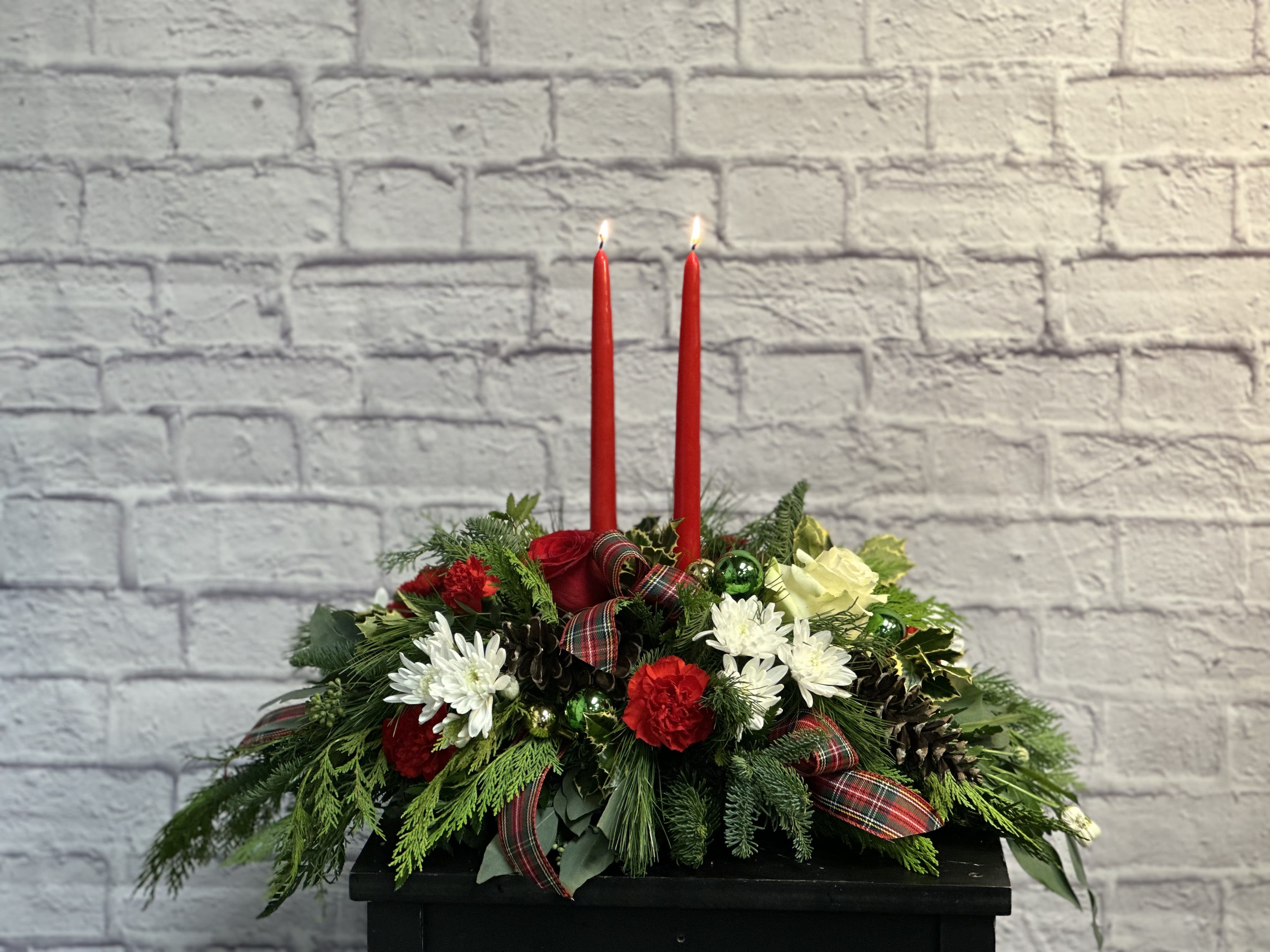 Christmas Centerpiece - A lovely way to grace any Christmas table.  Lighted centerpiece with a variety of Christmas blooms and evergreens.