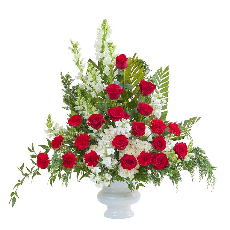 Classic remembrance of red and white - traditional classic styling featuring seasonal red and white flowers and a variety of greenery