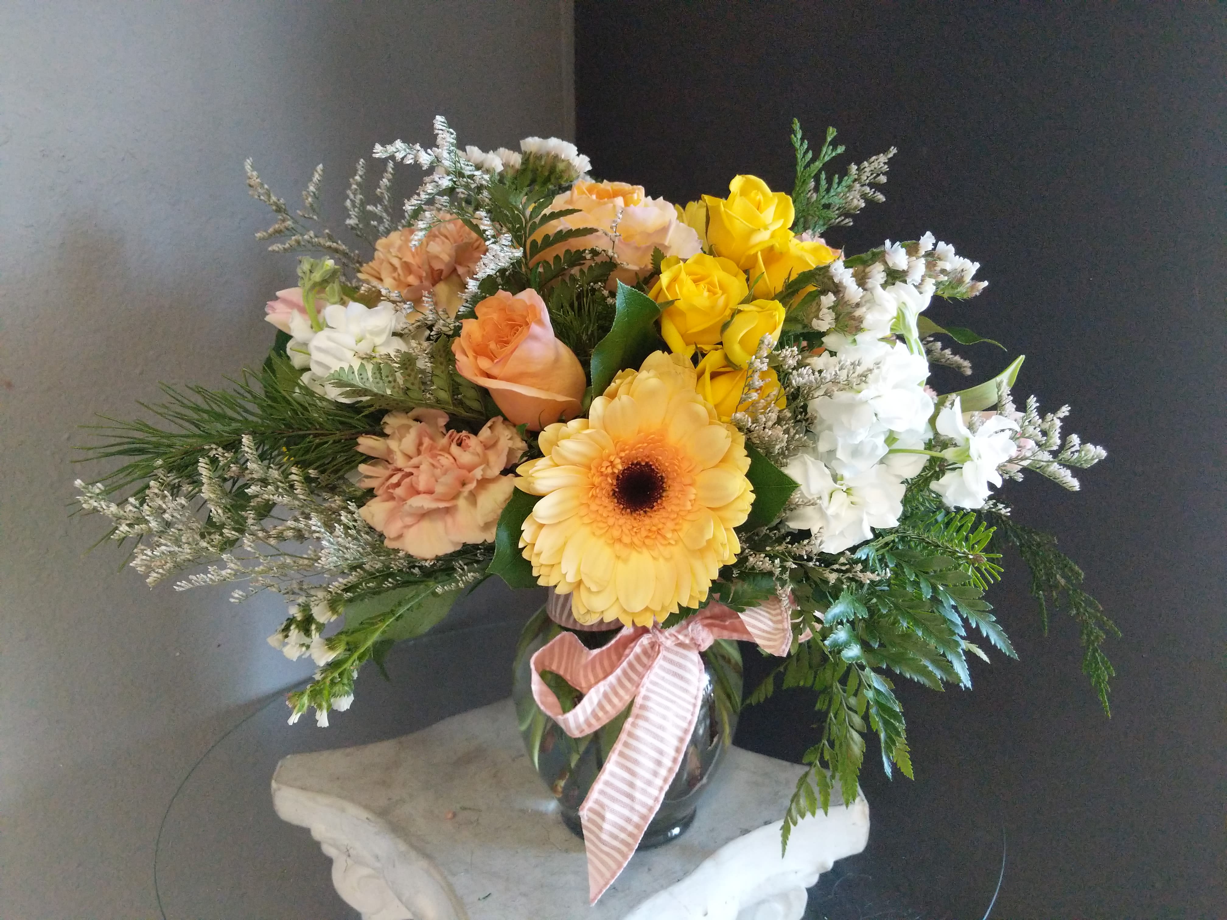 #111 Winter Floral Arrangement - A beautiful floral arrangement with seasonal fresh flowers in a vase. 