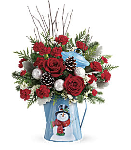 Snowy Day Bouquet - Pour on the Christmas charm with this radiant red bouquet, beautifully arranged in a vintage-inspired metal kettle with smiling snowman design.