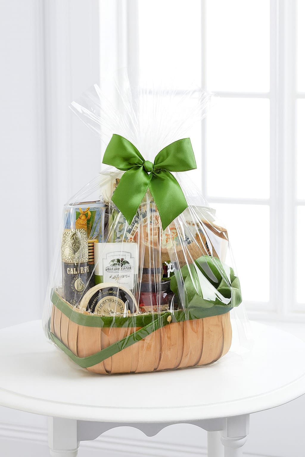 Gourmet Basket  24 hour notice needed - 24 hour notice is required  Gift Basket Information  Our gift baskets are thoughtfully designed, hand-packed, and individually wrapped in clear cello for a beautiful presentation. Each basket is finished with coordinating bows and seasonal accents. Custom baskets can be created for any occasion, and we are happy to accommodate large quantity orders with advance notice.  If you need  vegan or gluten free please call or list that under special instructions  Please note: Photos on our website represent examples of seasonal decorations. Containers, bows, picks, and other decorative elements may vary based on availability. Product contents will remain as consistent as possible, but may be substituted when necessary. We kindly ask for 24 hours’ notice on all basket orders.