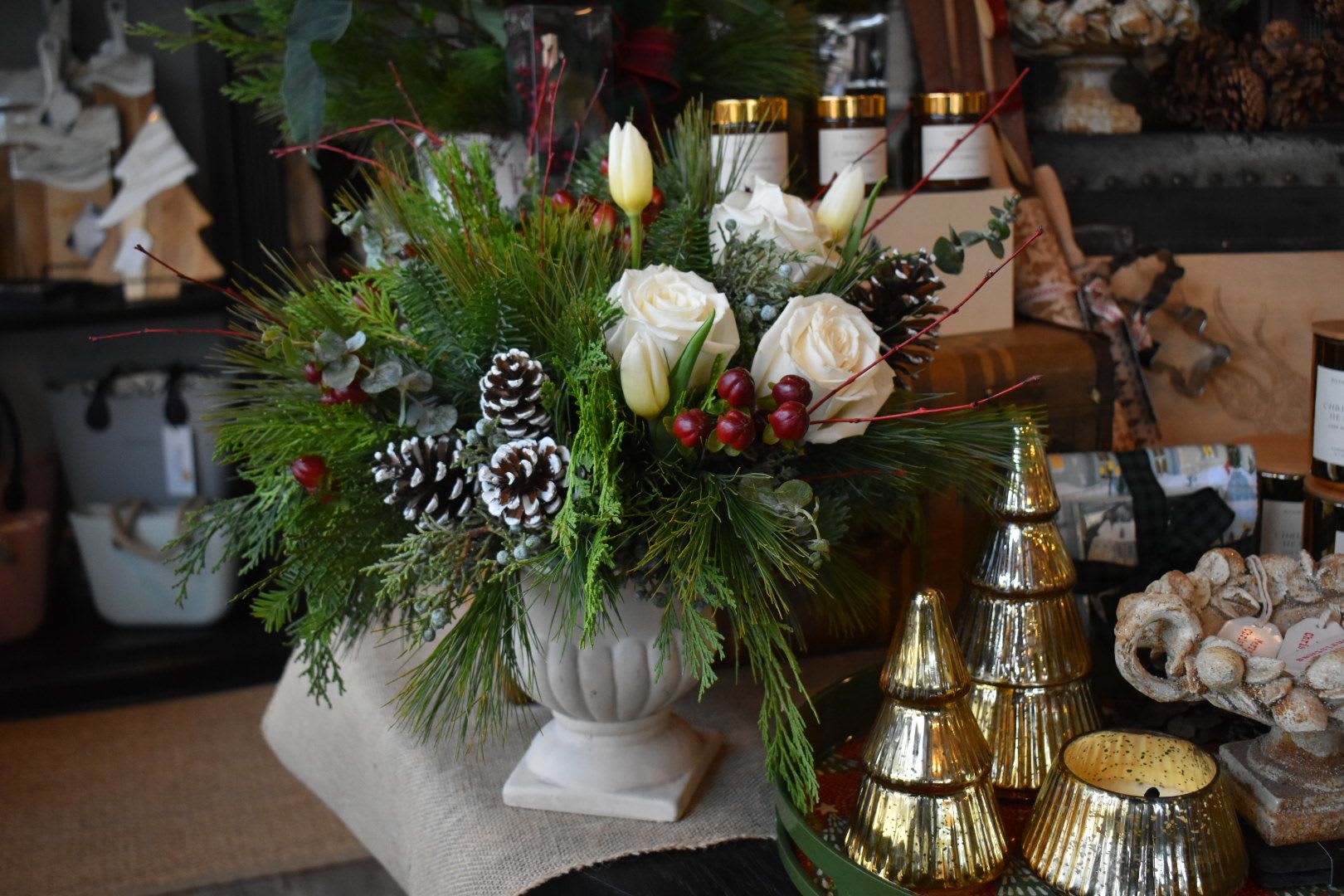 Pine, Rose &amp; Berry - We've combined evergreens, hypericum and white roses for the ultimate holiday centerpiece, perfect for your hearth or your table.