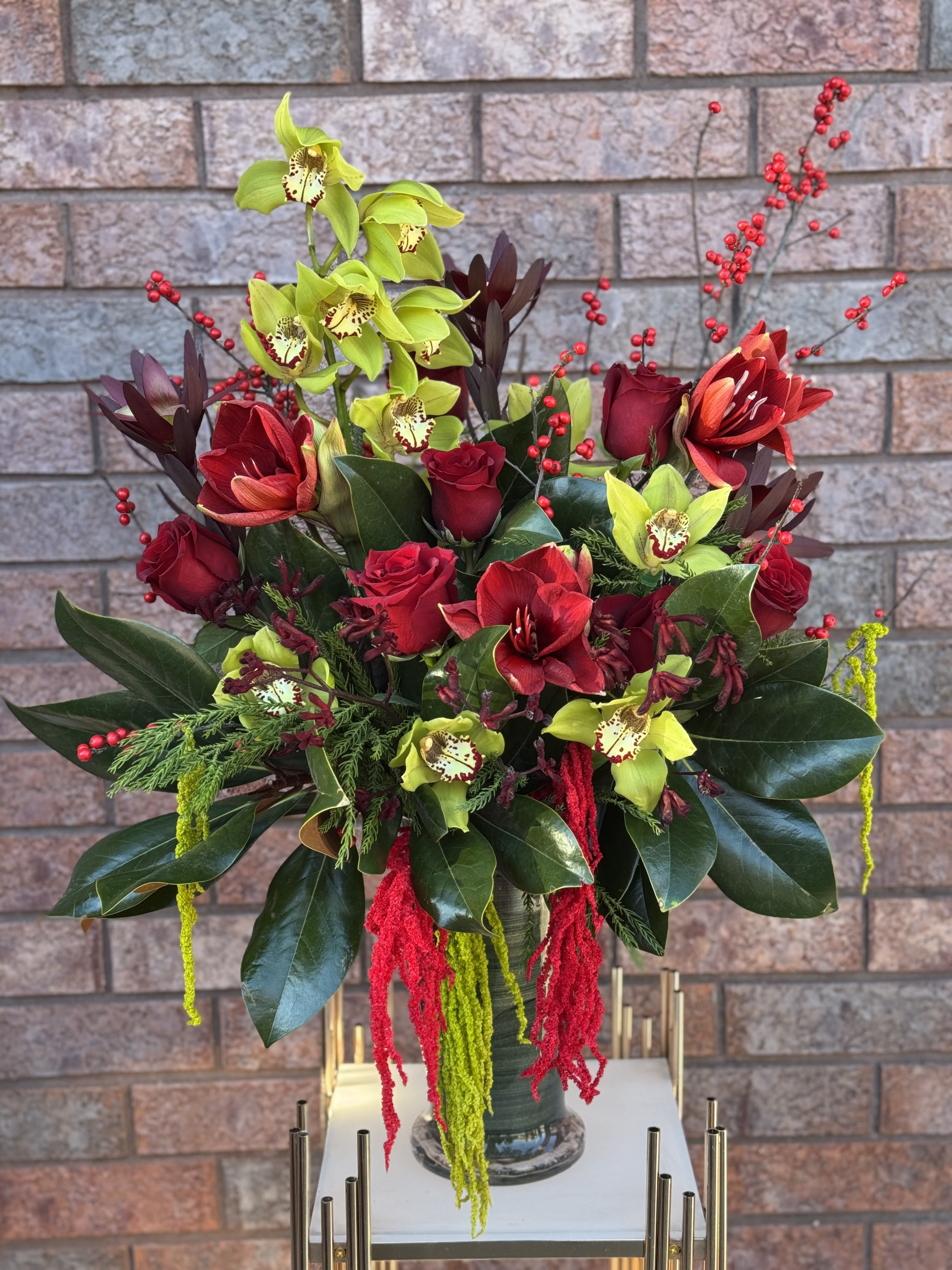 Holiday Floral Arrangement in a vase.     The photo shows a premium size. - The photo shows a premium size.