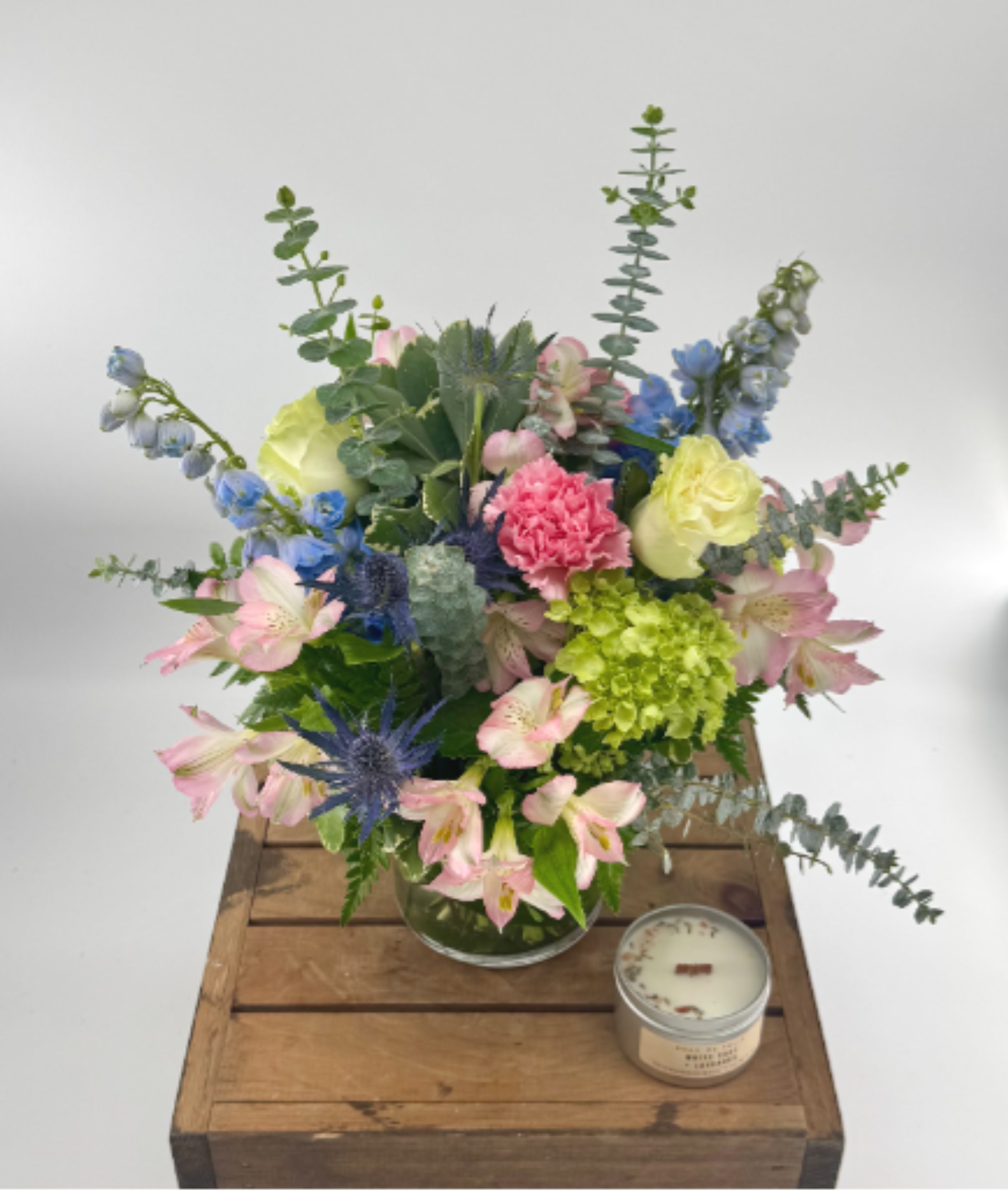 Breathtaking Blossoms  - You’d like to surprise someone with gorgeous fresh flowers…a mix of blooms that looks as if the entire garden has been put into a vase! This splendid medley of blue, cream, white, pink and lavender flowers, presented in a 5x5" glass cylinder vase, is a beautiful choice. 