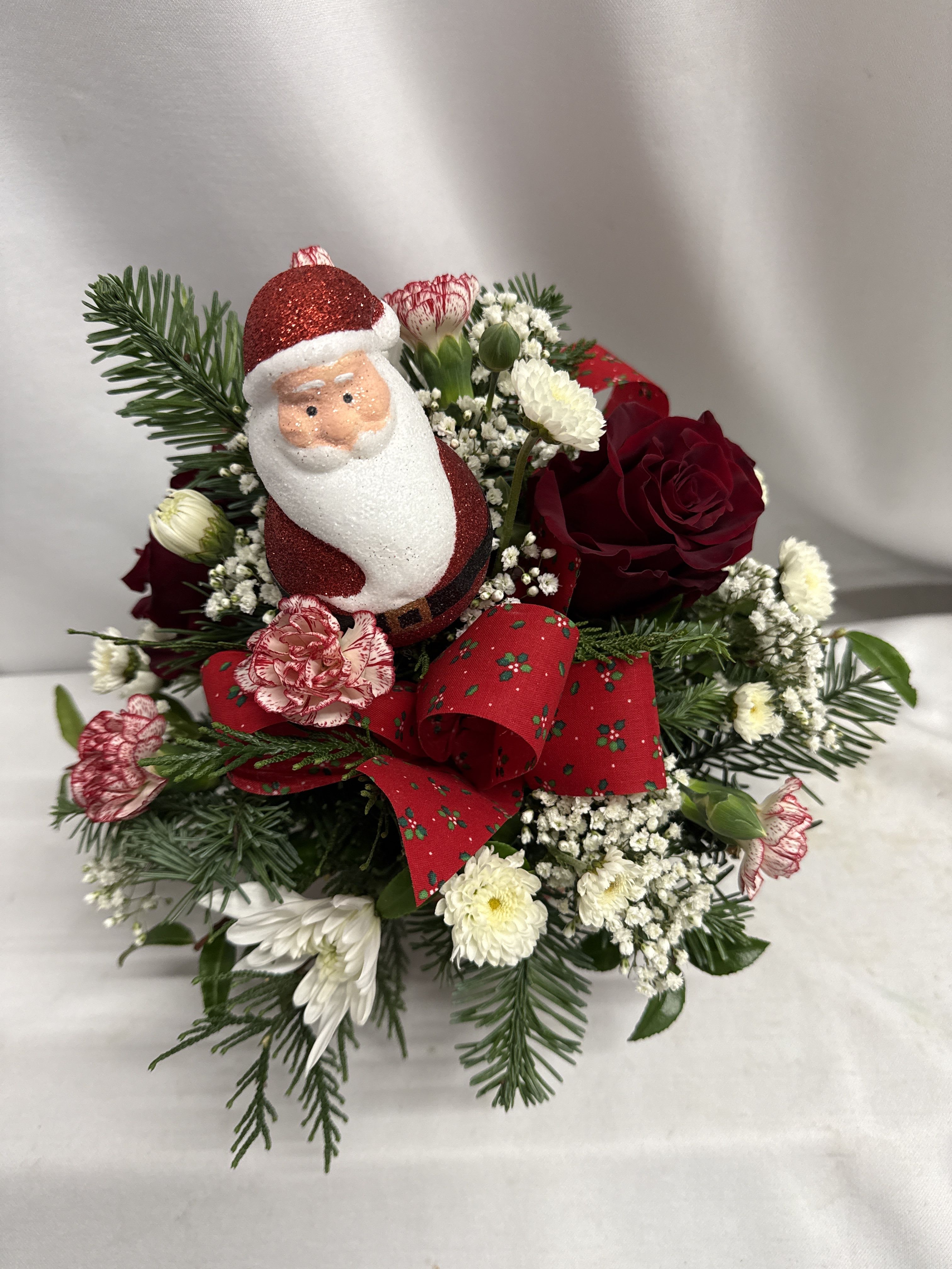 Christmas cheer! - Assorted holiday greens our premium, Explorer roses, carnations , and chrysanthemums. Designed in a keepsake bowl dishwasher and  microwave safe bowl.