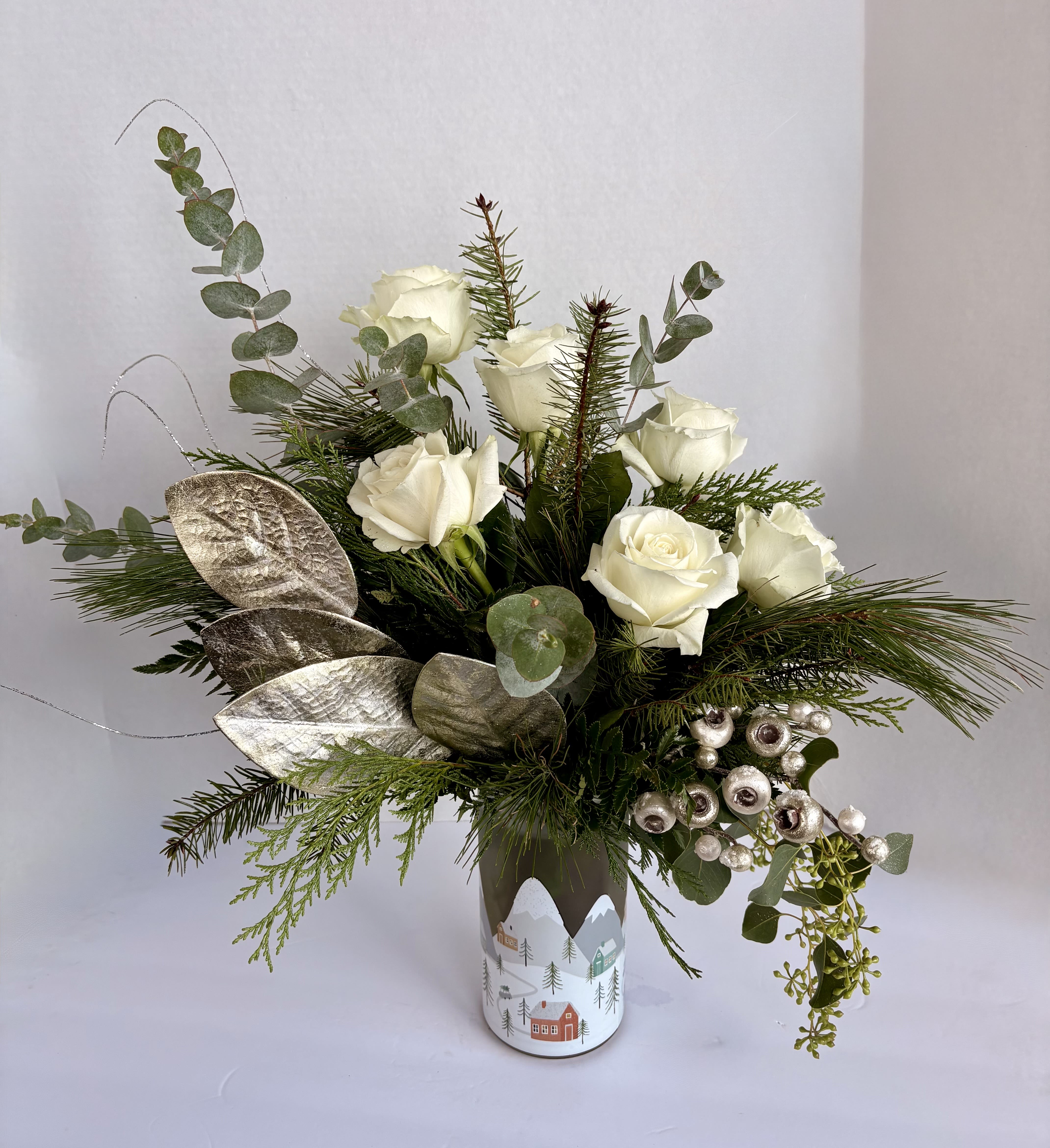 Northwoods Winter - This bougie bouquet of a half a dozen white roses is perfect for the elegant loved ones in your life. Welcome in the winter spirit with evergreens, roses, and sparkles! 