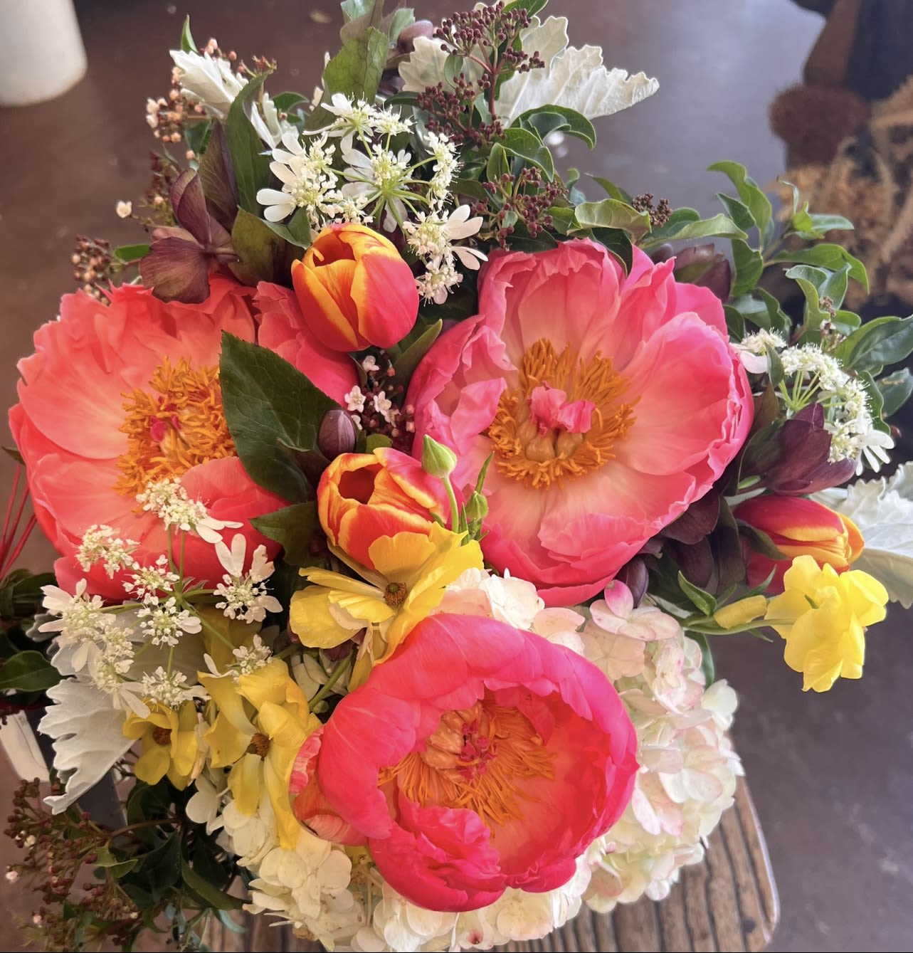 Coral Crown  - A vibrant embrace of coral, gold, and gentle whites—an uplifting bouquet fit for a queen of spring.