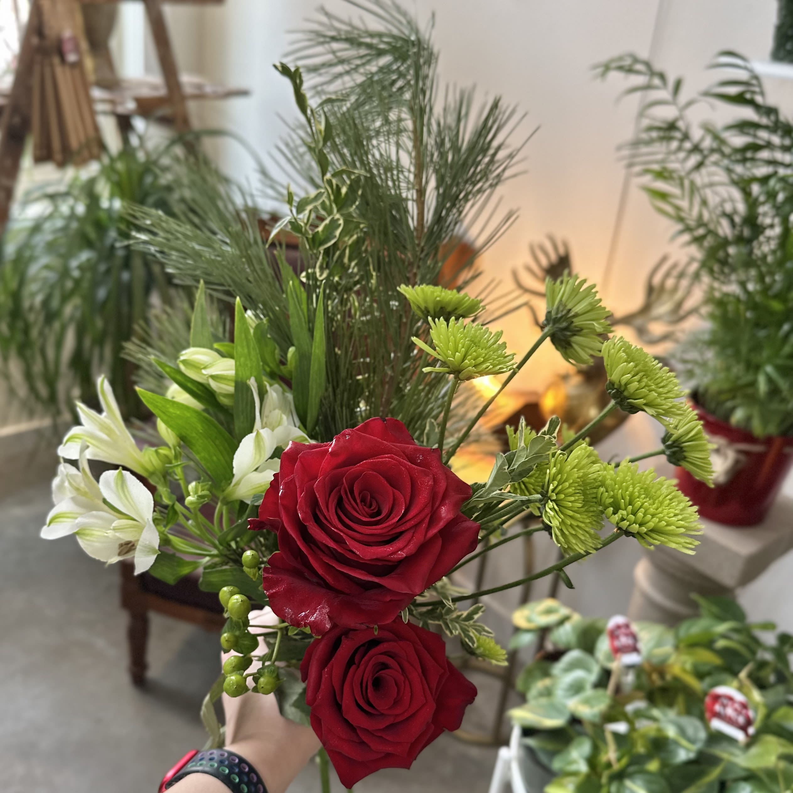 Santa Baby Wrapped Bouquet - Red roses, whites and greens create a festive holiday bouquet.